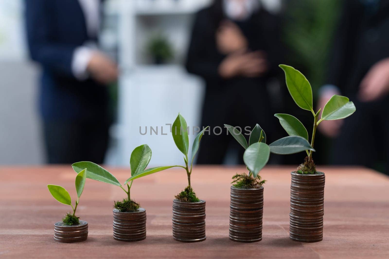 Organic money growth investment concept with stacking coin and plant. Quaint by biancoblue