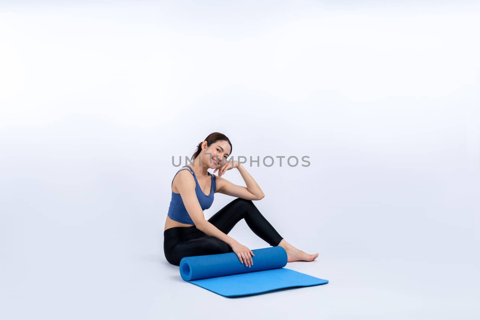 Young attractive asian woman portrait in sportswear with exercising mat Vigorous by biancoblue