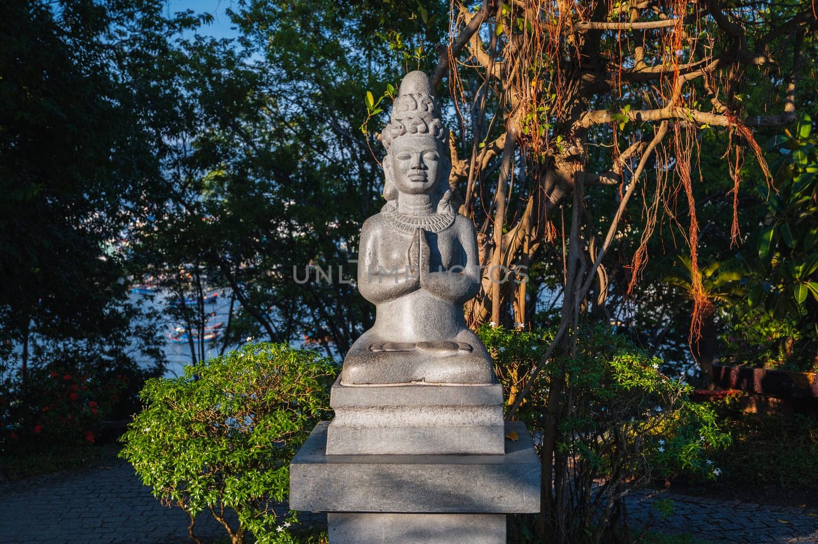 Buddhist statue of a female deity in park at the pagoda at the Cham Towers in Nha Trang, Vietnam