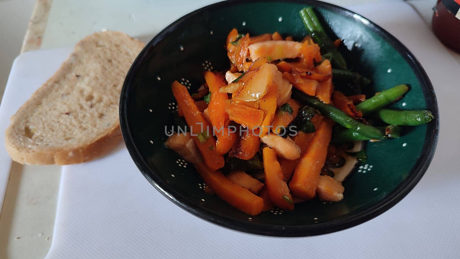 vegetables and fish, healthy food in a green plate. High quality photo