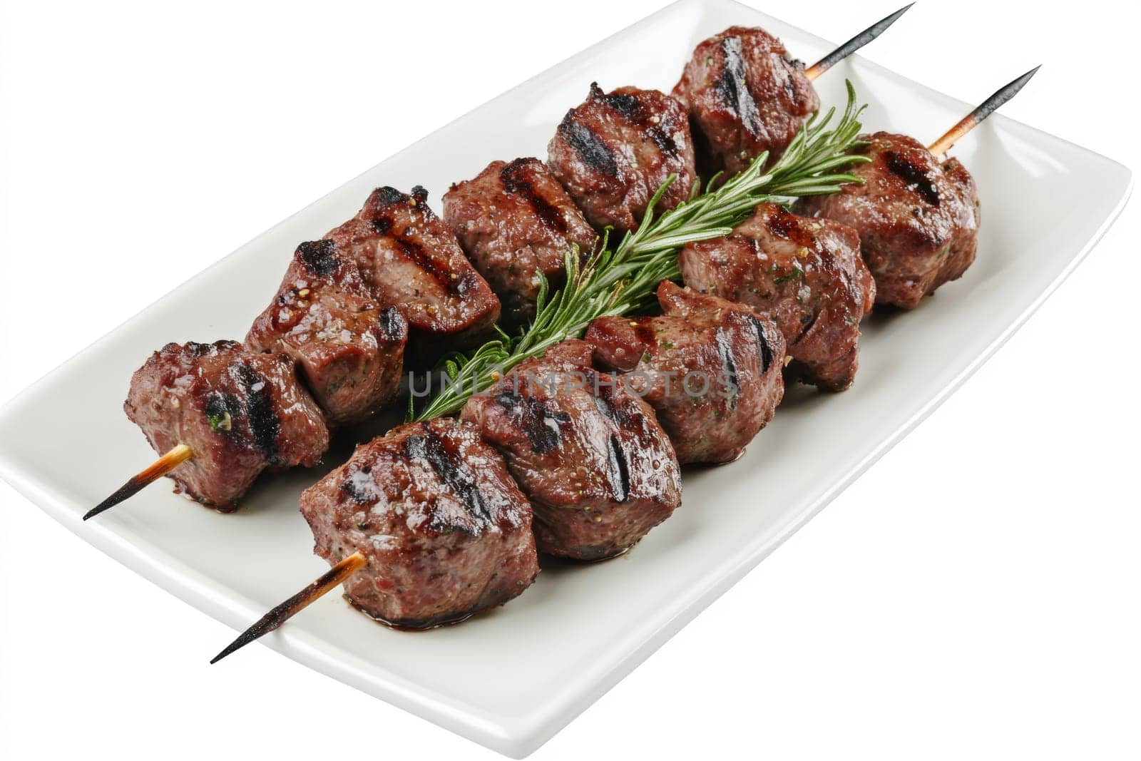 Juicy shashlik on a white plate. Side view. High quality photo