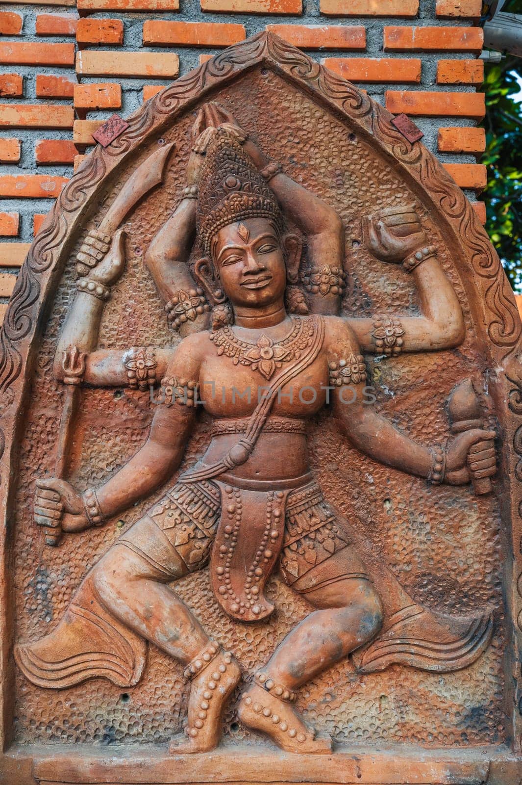 sculpture statue of the god Shiva on a Buddhist pagoda in Asia in Vietnam