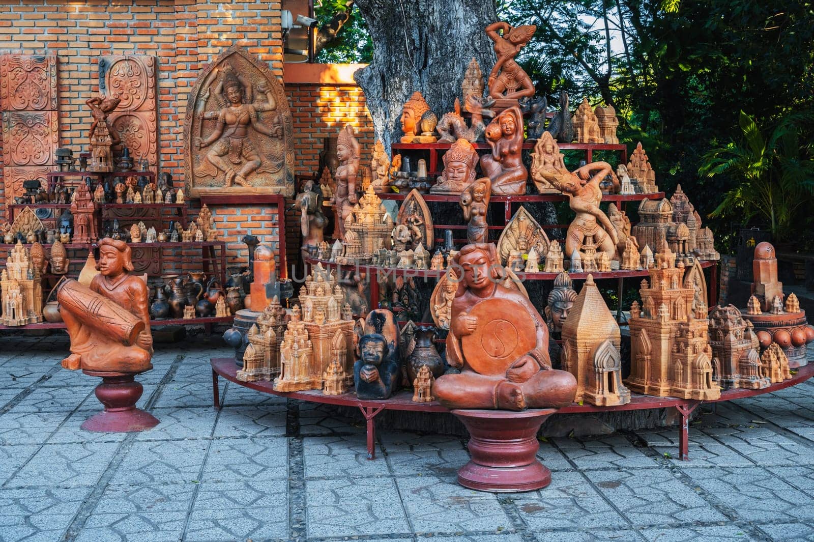 Buddhist religious clay figurines and pottery in souvenir shop on the Po Nagar Cham Towers in Nha Trang, Vietnam