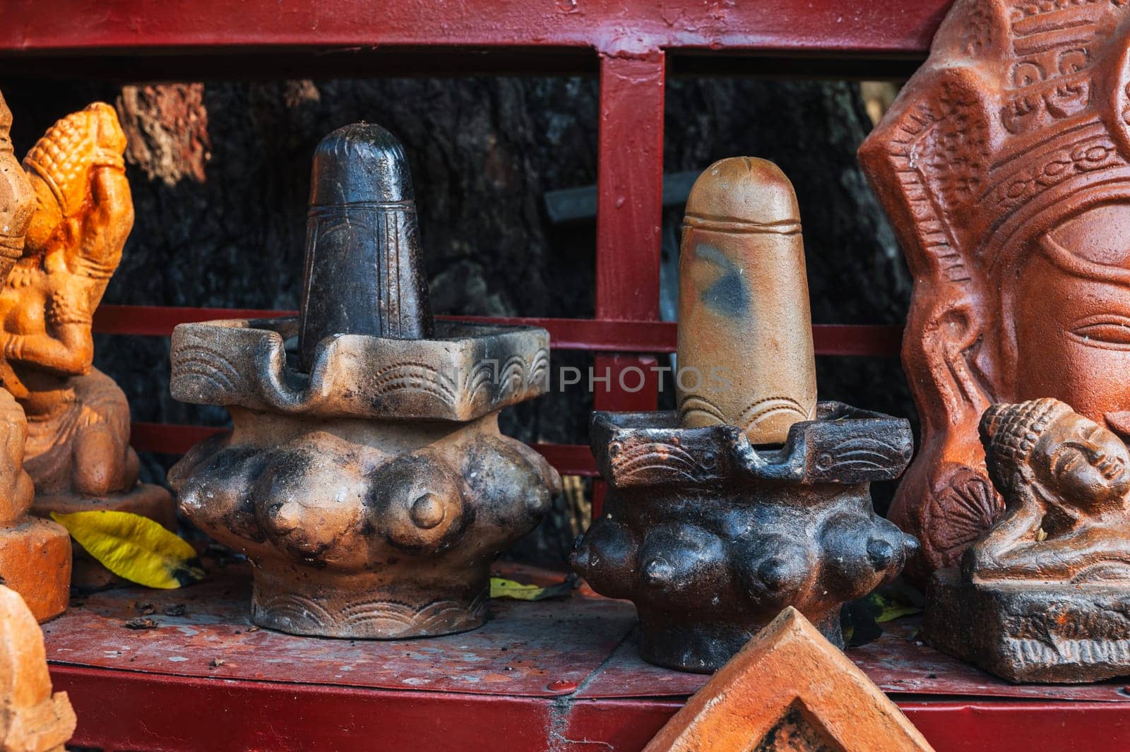 Clay figurines and statues of lingam in a souvenir shop in Vietnam in Asia