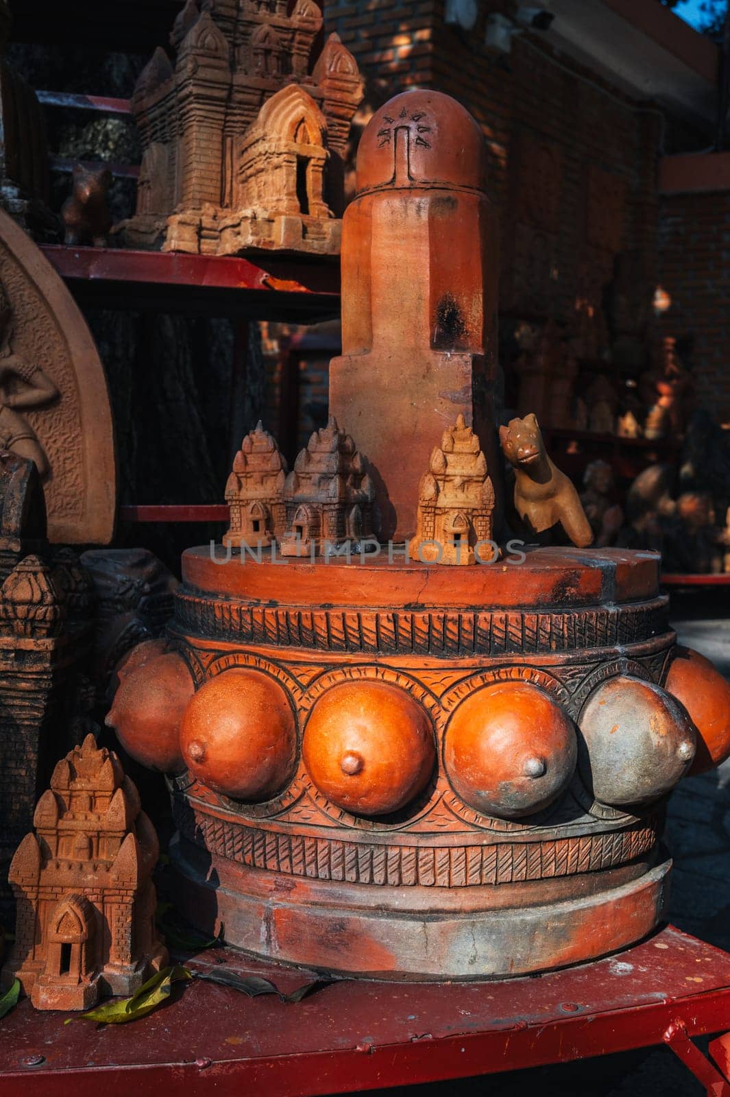 Clay figurines and statues of lingam in a souvenir shop in Vietnam in Asia