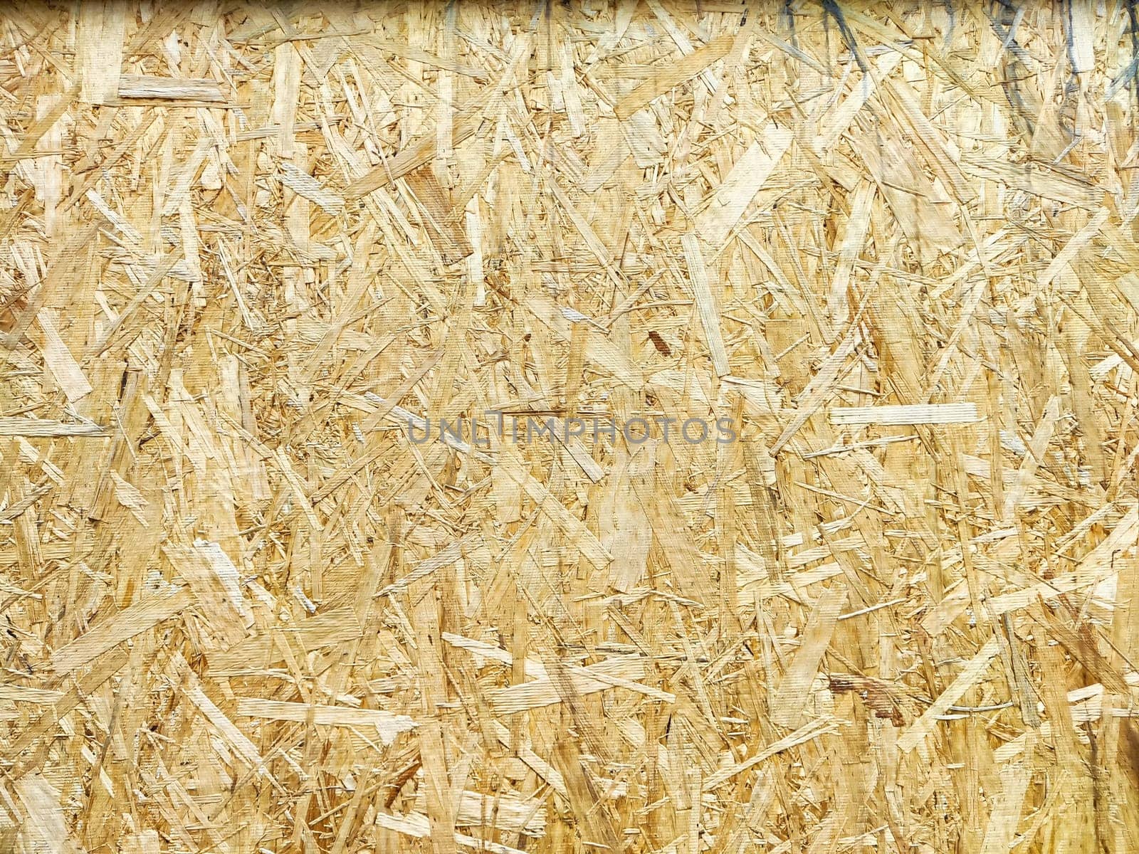 Detailed view of oriented strand board showcasing its unique texture and pattern.