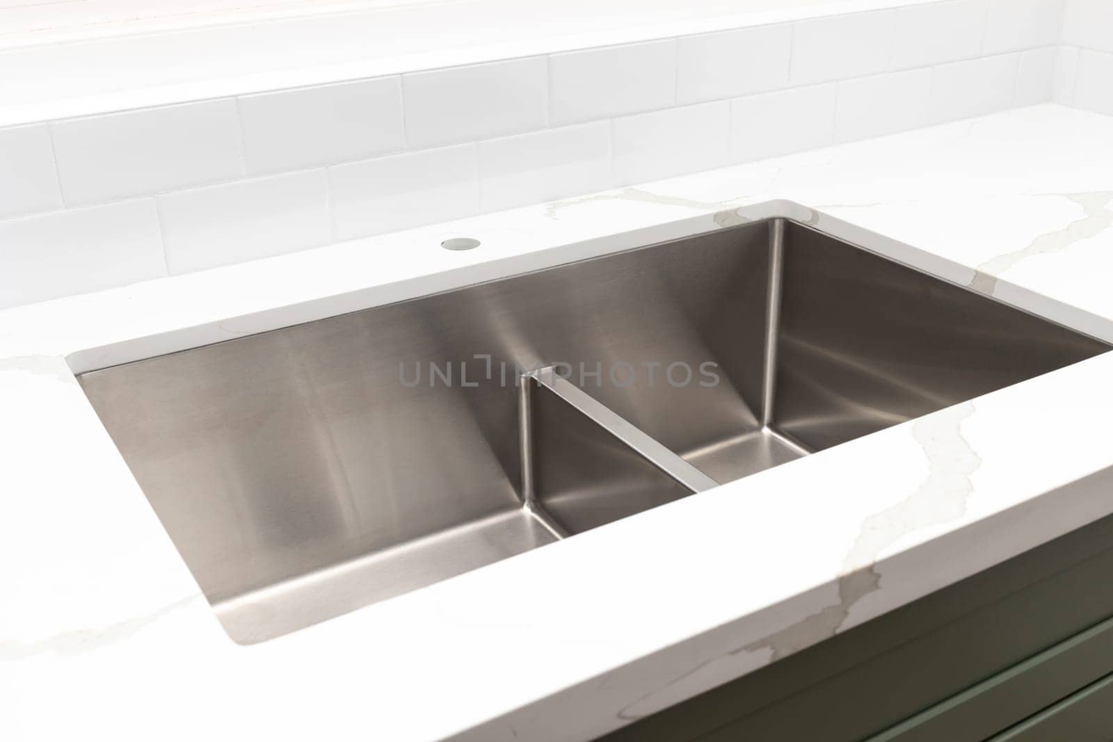 Custom Quartz Marble Countertop, Sink, Faucet Installation at the Kitchen. Green Wooden Cabinets. Plumbing Service. Cozy Home Design. Building Material. Horizontal. Appliances. White Tiles