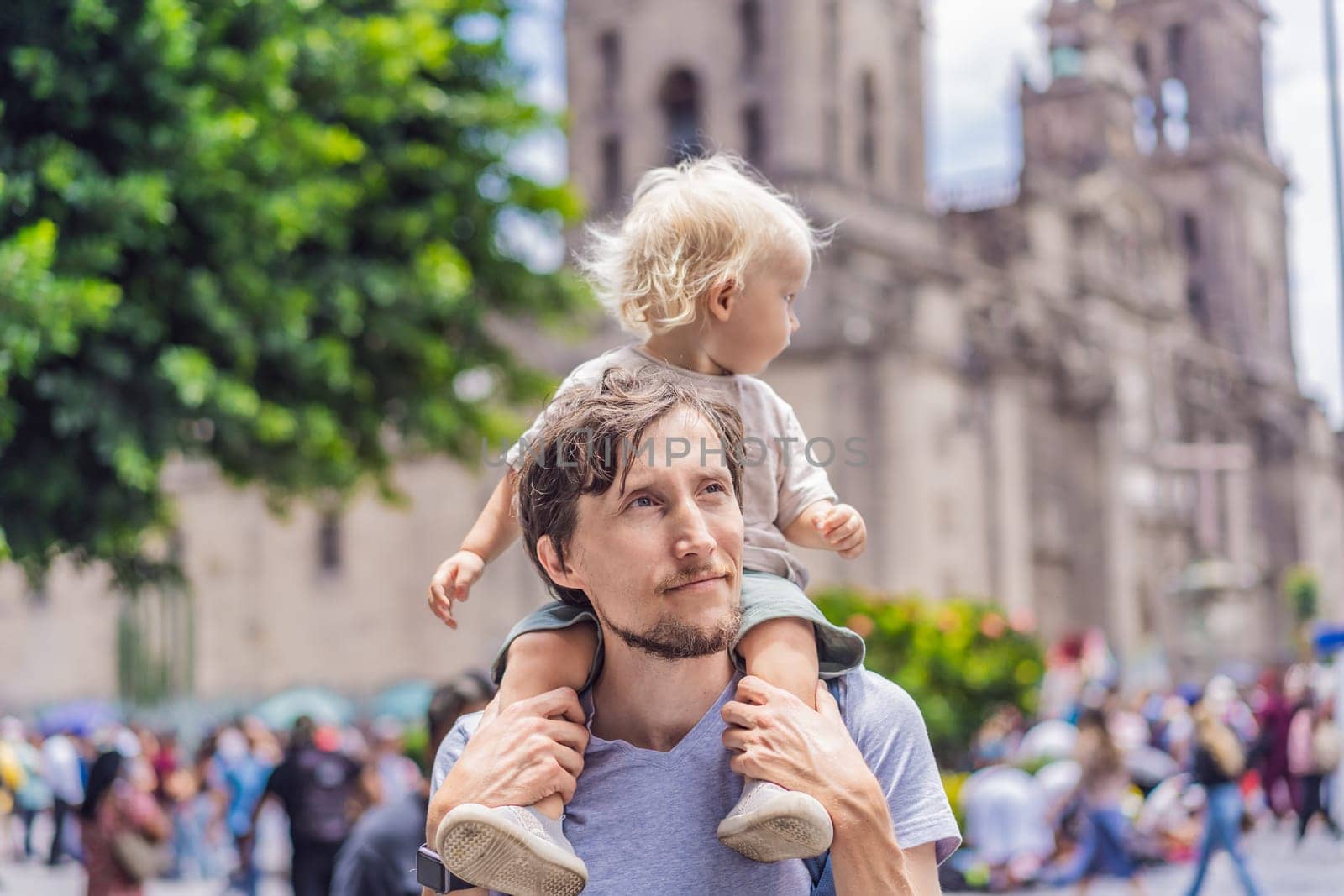 Father and son therists in front of Catedral Metropolitana de la Ciudad de Mexico. Cultural exploration, historic architecture, and travel experience concept.
