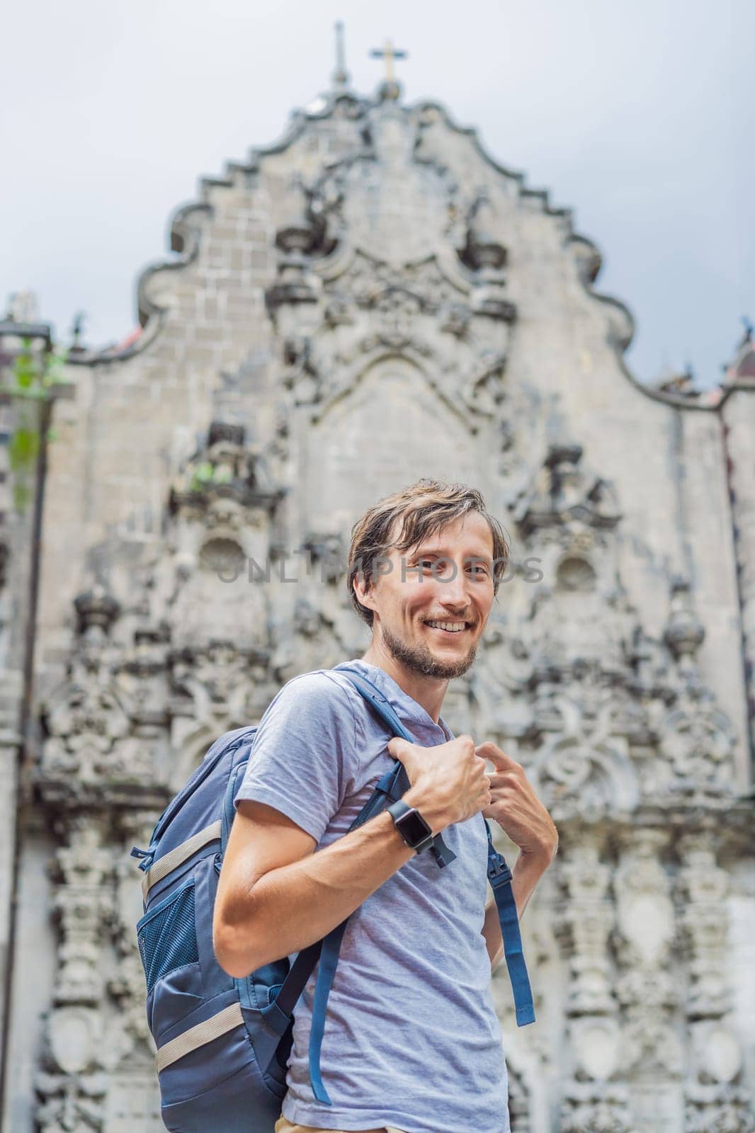 Male tourist in the central square of Mexico City, Zocalo. Cultural exploration, travel, and historic architecture concept.