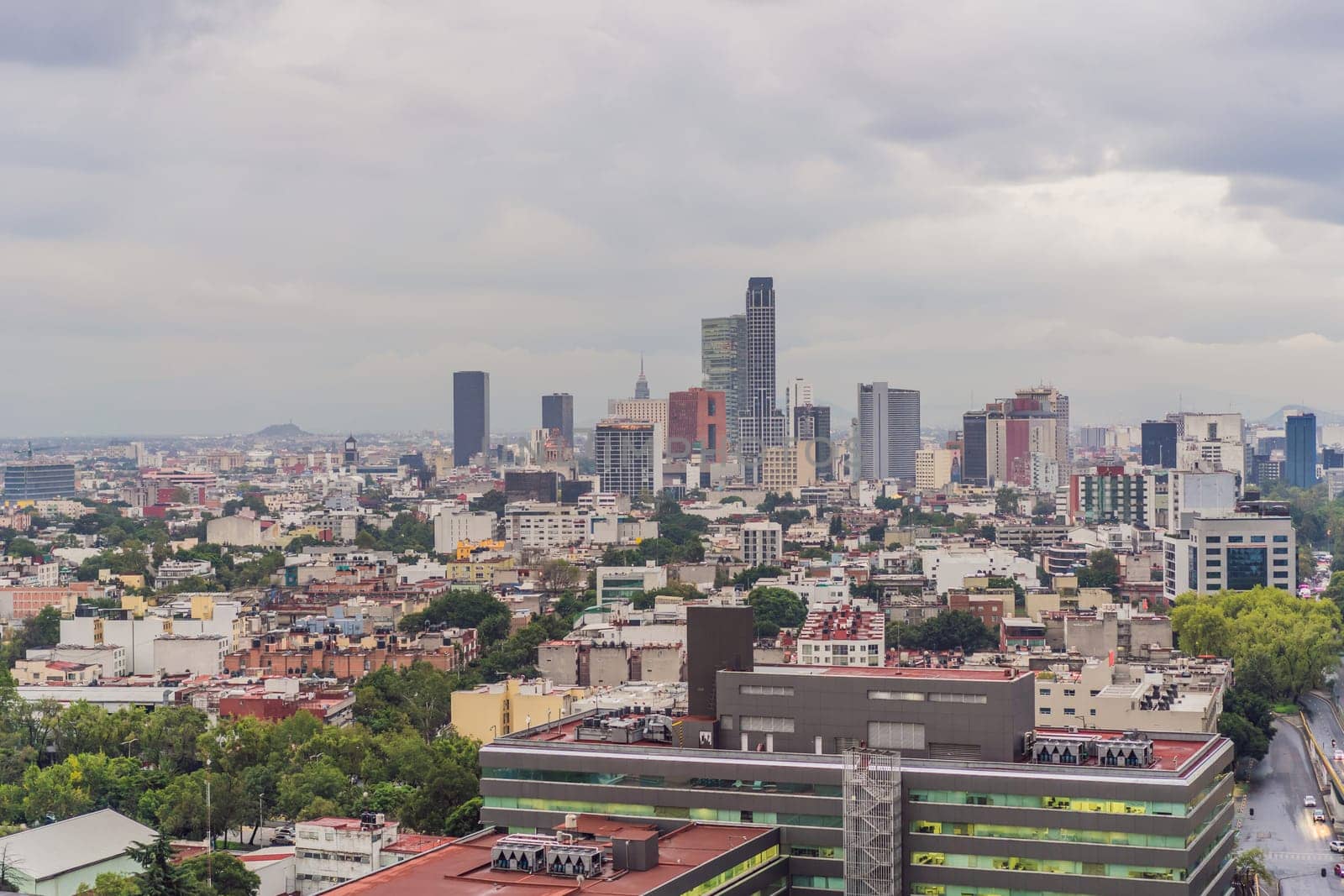 Panoramic view of Mexico City from above, showcasing the sprawling urban landscape, iconic landmarks, and vibrant culture. Cityscape, travel, and architecture concept.