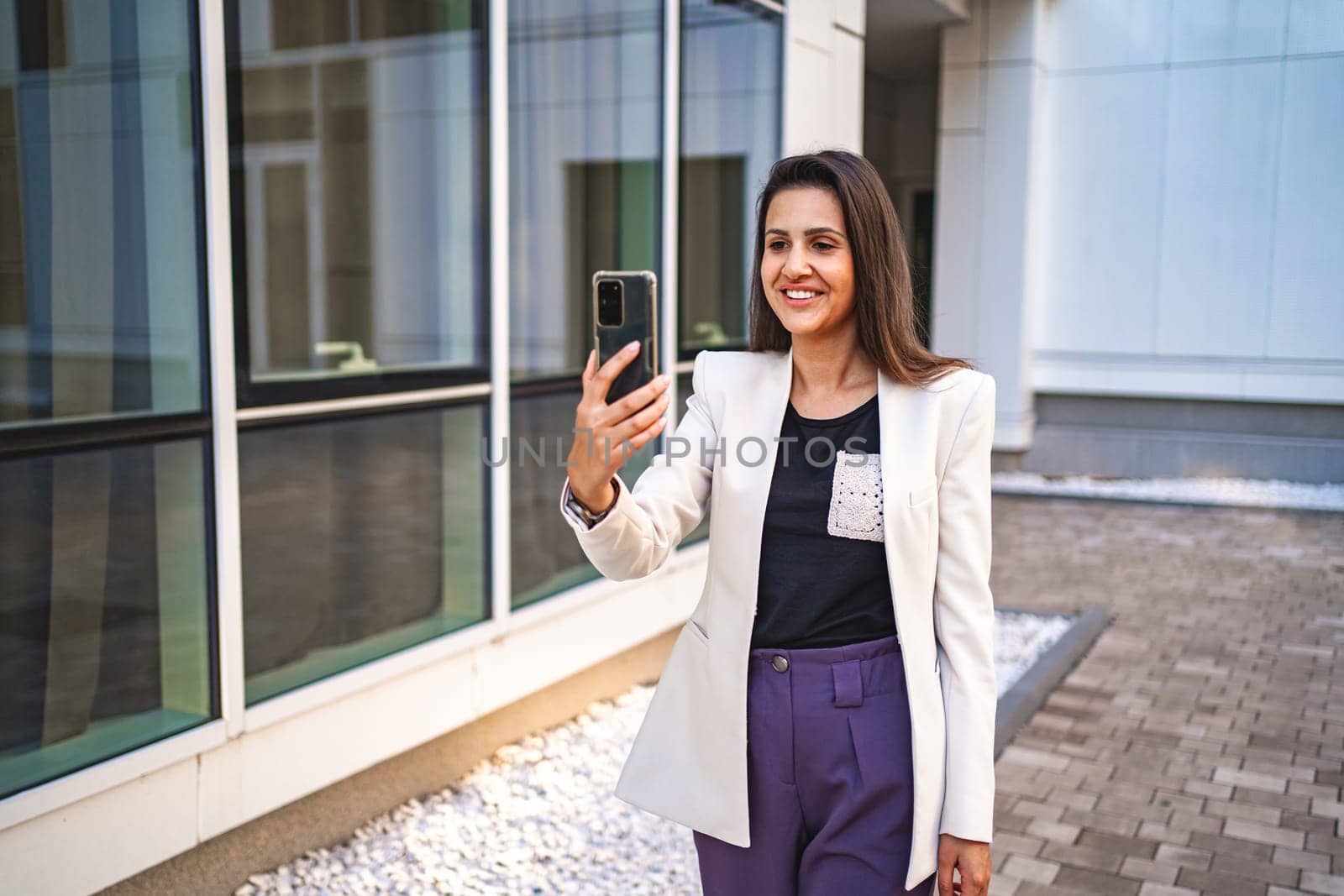 Businesswoman talking on a video call after work.