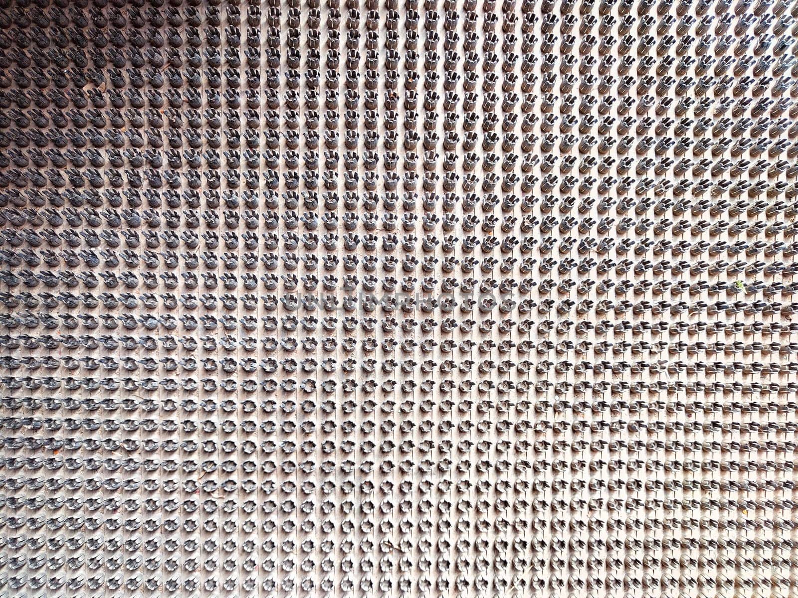 A detailed perspective of a surface filled with numerous small metallic components.