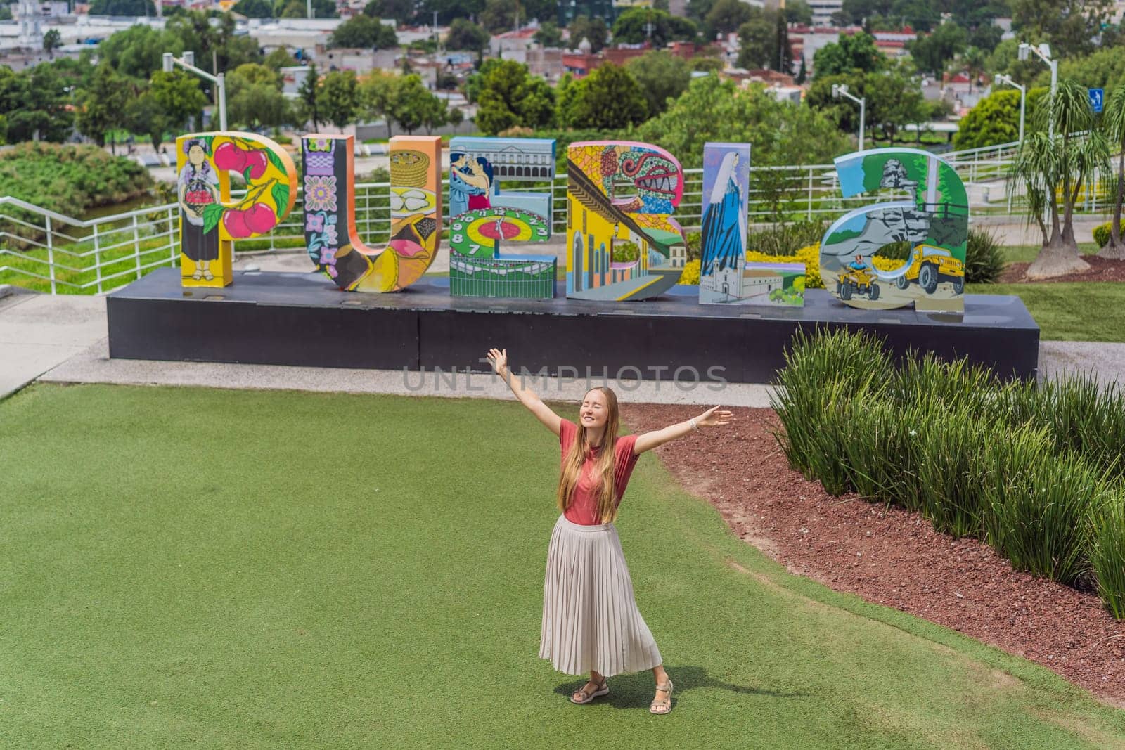 Female tourist in front of the panoramic view of Puebla city, Mexico. Travel, cultural exploration, and scenic landscape concept.