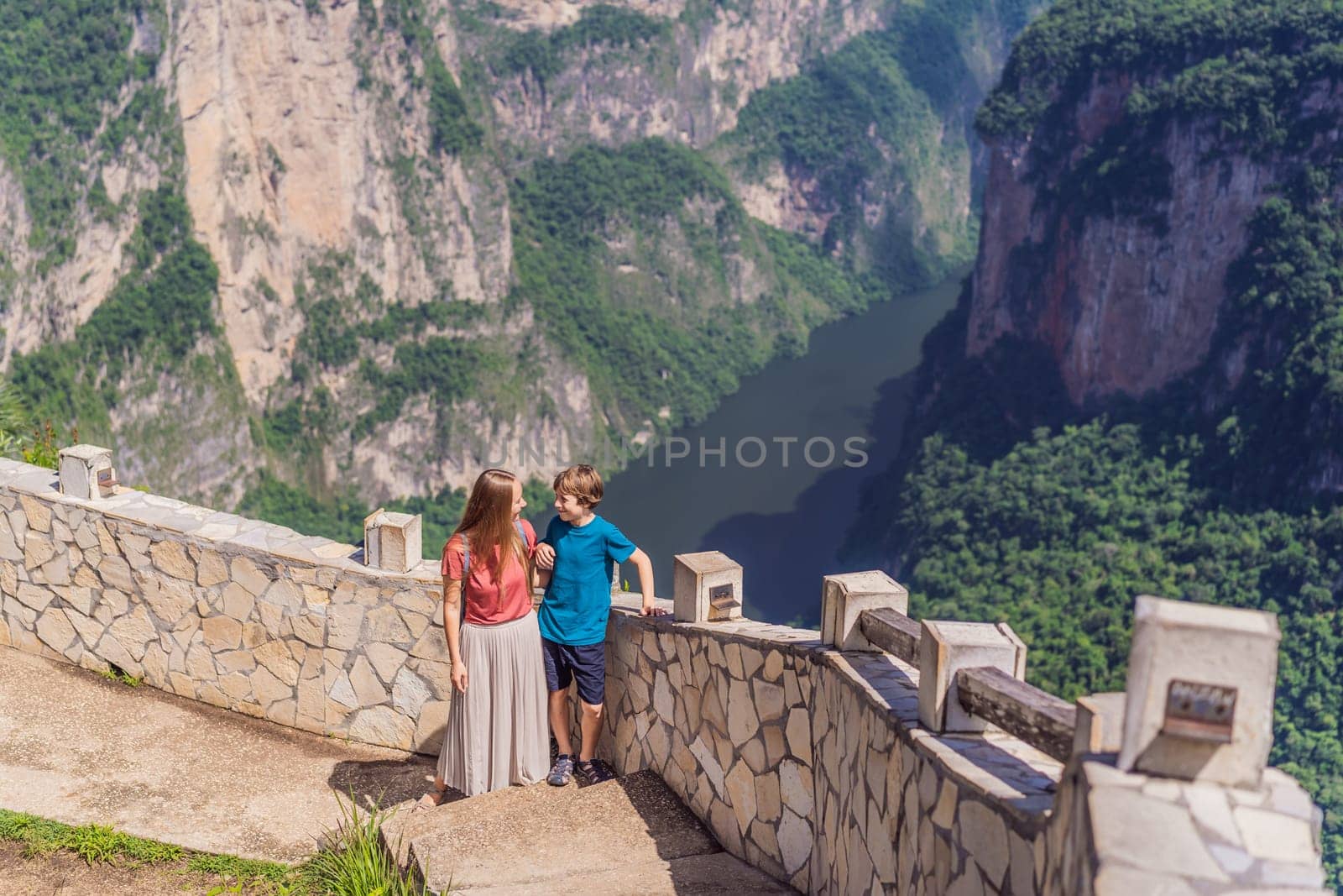 Mom and her son travelers exploring Sumidero Canyon National Park, Mexico. Adventure, natural exploration, and travel experience concept.