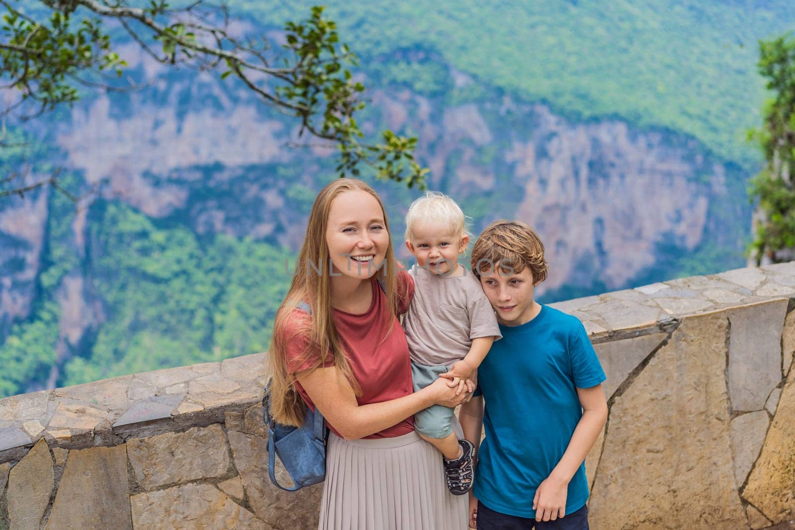 Mom and her two sons baby and teenager travelers exploring Sumidero Canyon National Park, Mexico. Adventure, natural exploration, and travel experience concept.