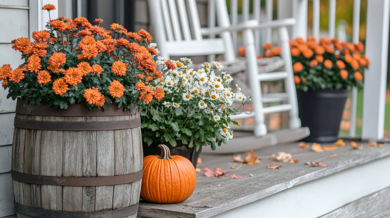 Decorating the porch and front door with pumpkins and fall flowers. Decorating the house for the traditional holiday. High quality photo