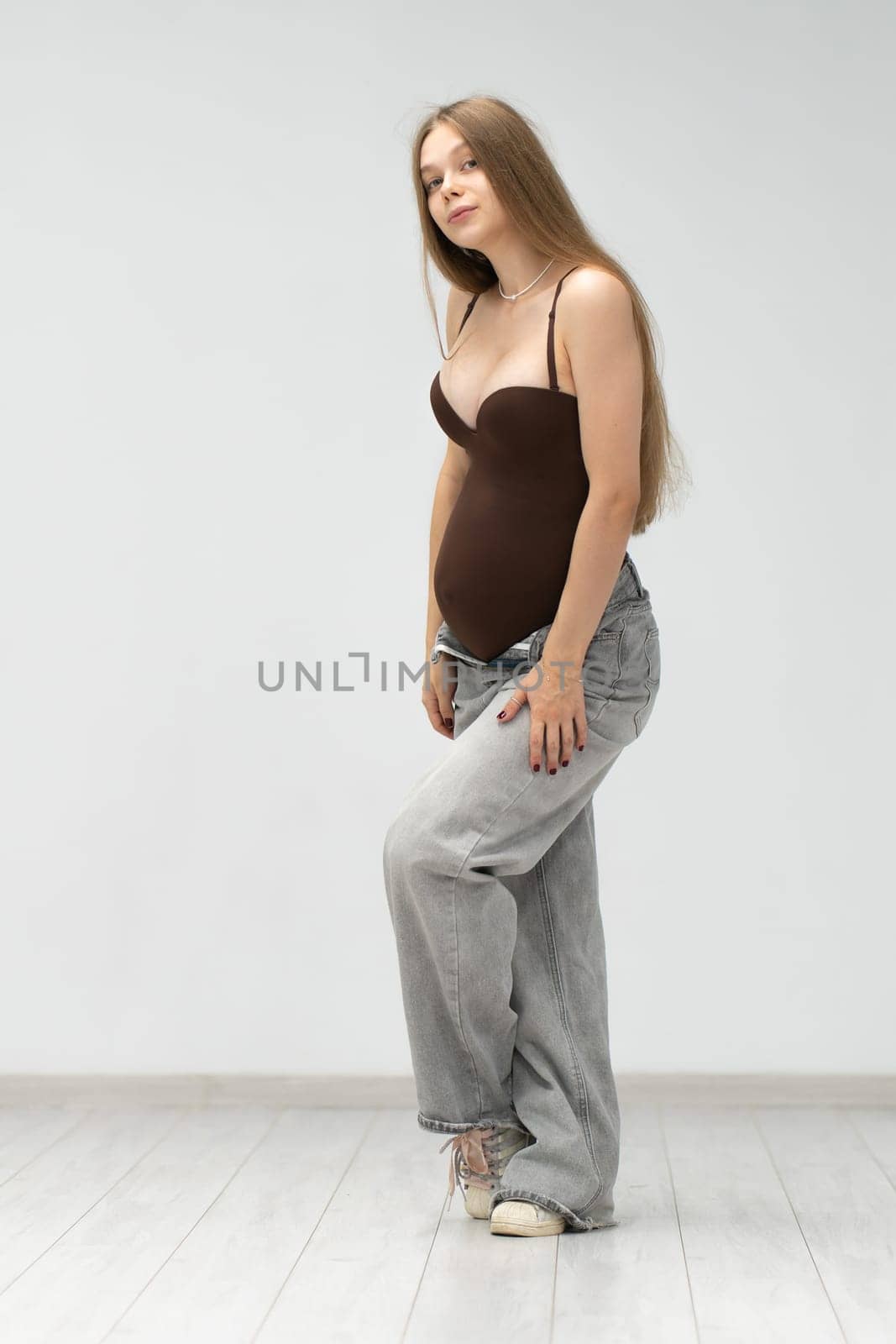 expectant girl background tummy mother positive pregnancy happy jeans maternity female motherhood