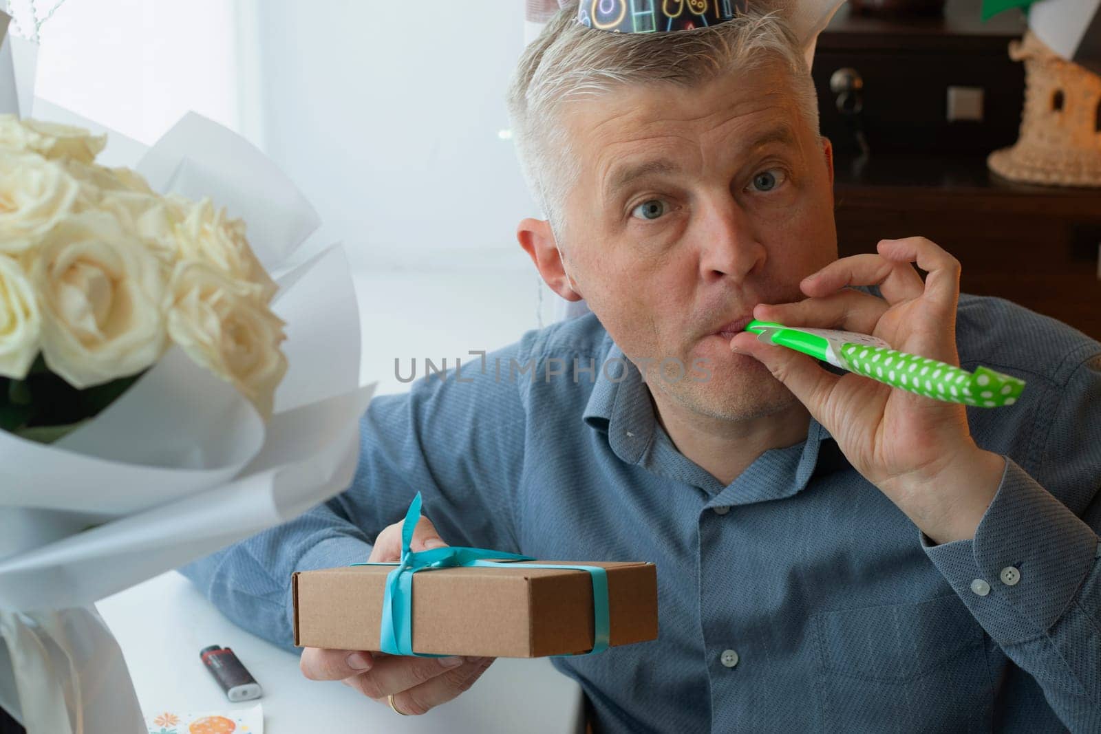 Mid aged man celebrating alone