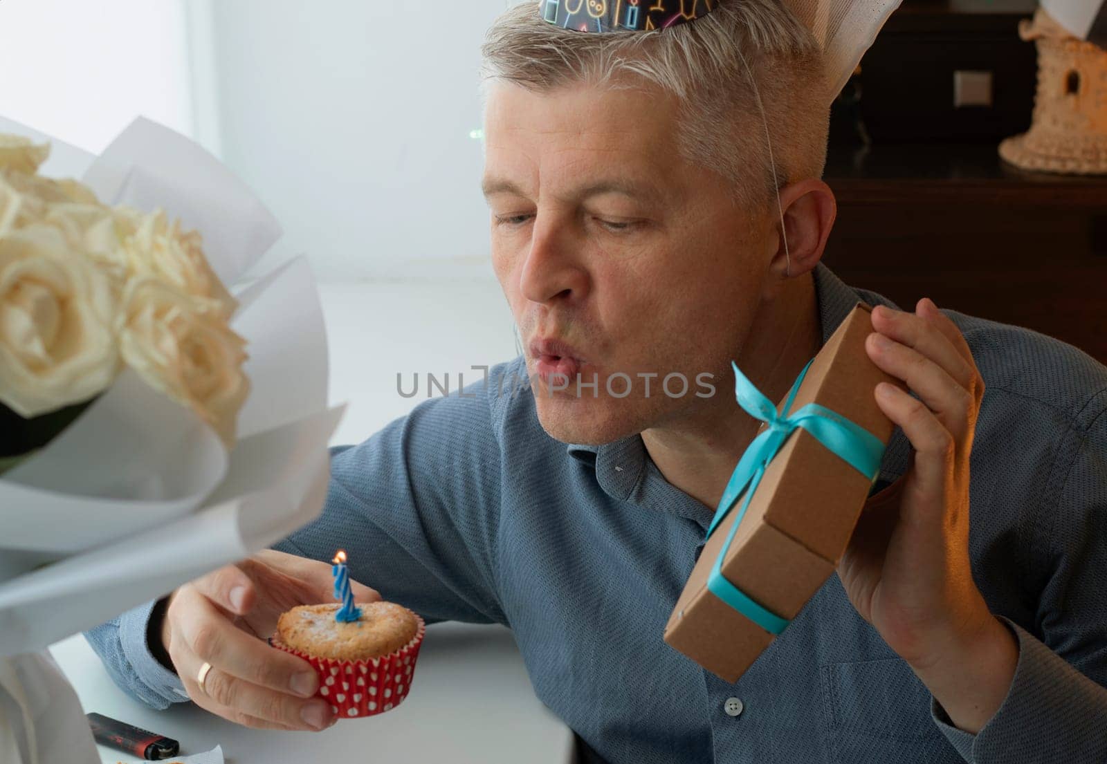 Mid aged man celebrating alone.