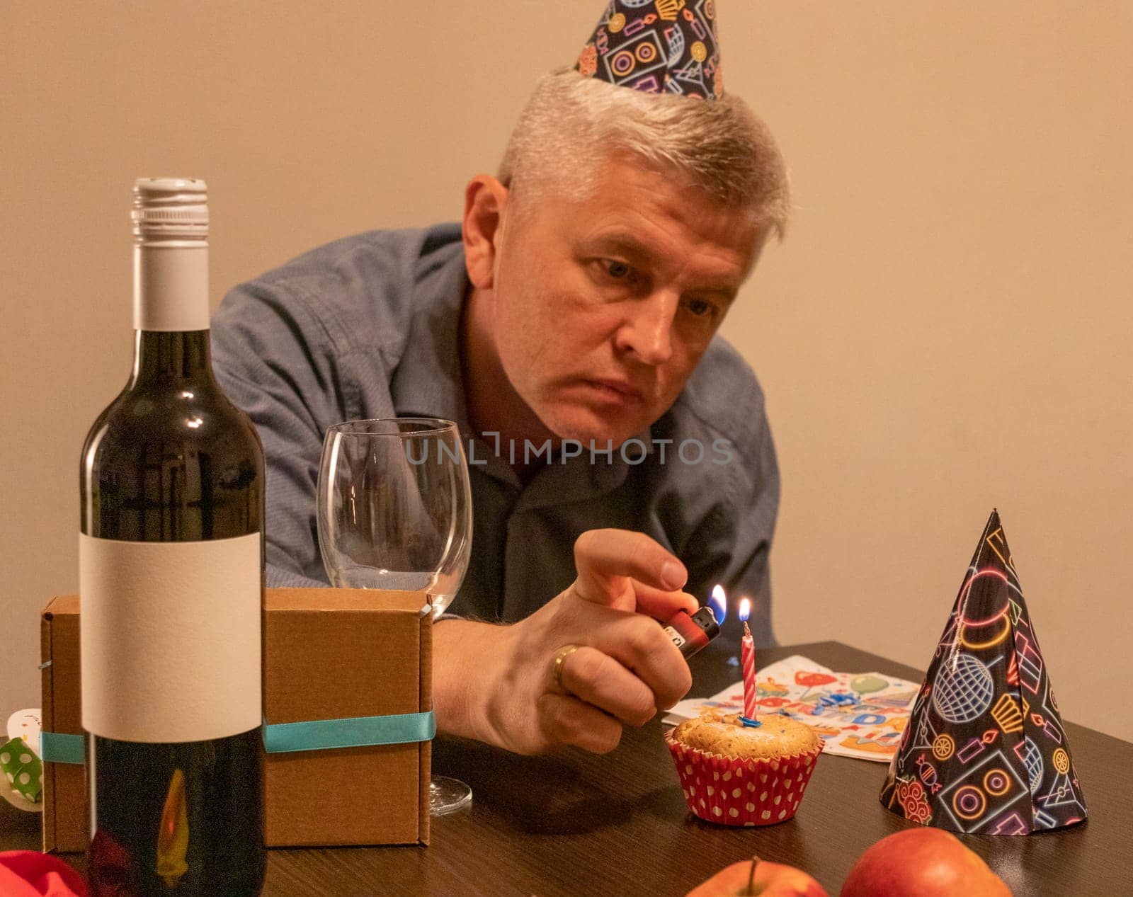 Mid aged man celebrating alone.