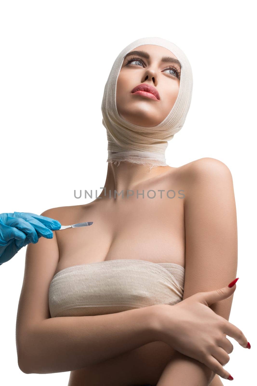 Pretty girl her head and neck bandaged at plastic surgeon medical examination isolated shot on white background