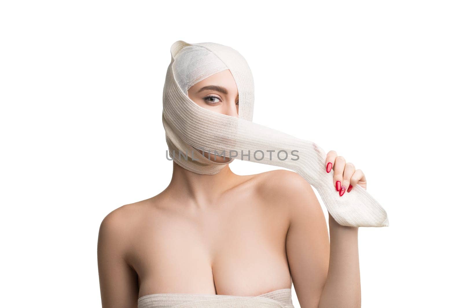 Beautiful woman with bandaged face after plastics isolated shot on white background