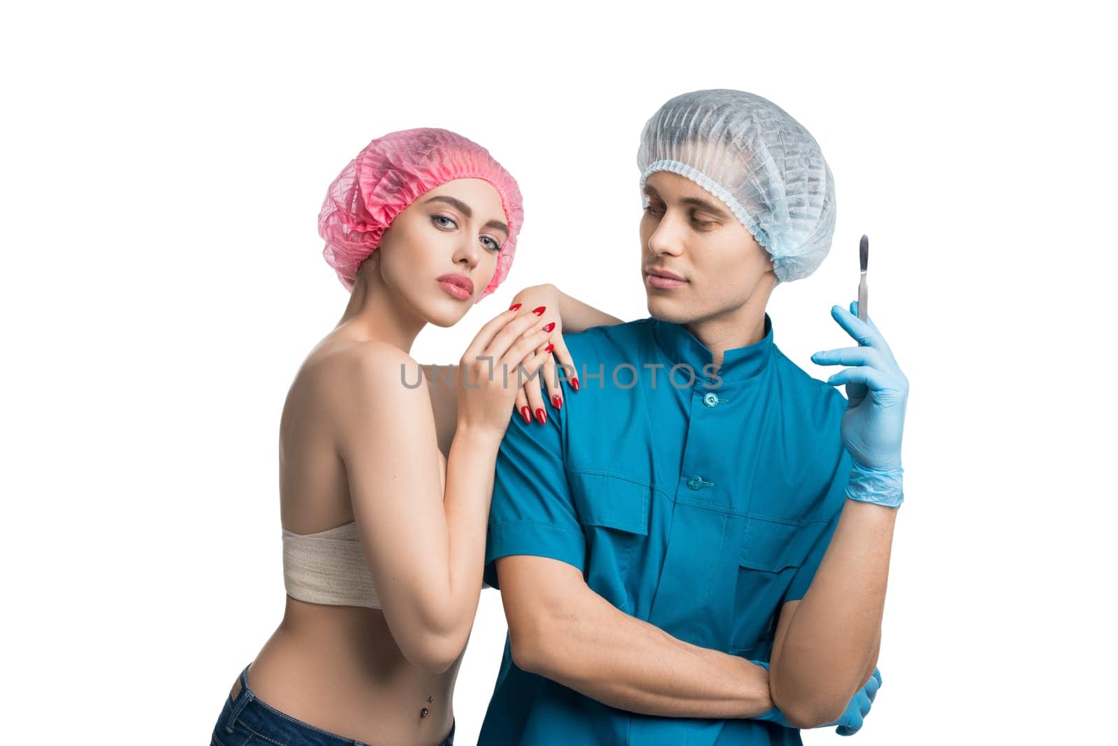 Handsome plastic surgeon with his female pretty patient staying in profile isolated portrait on white background