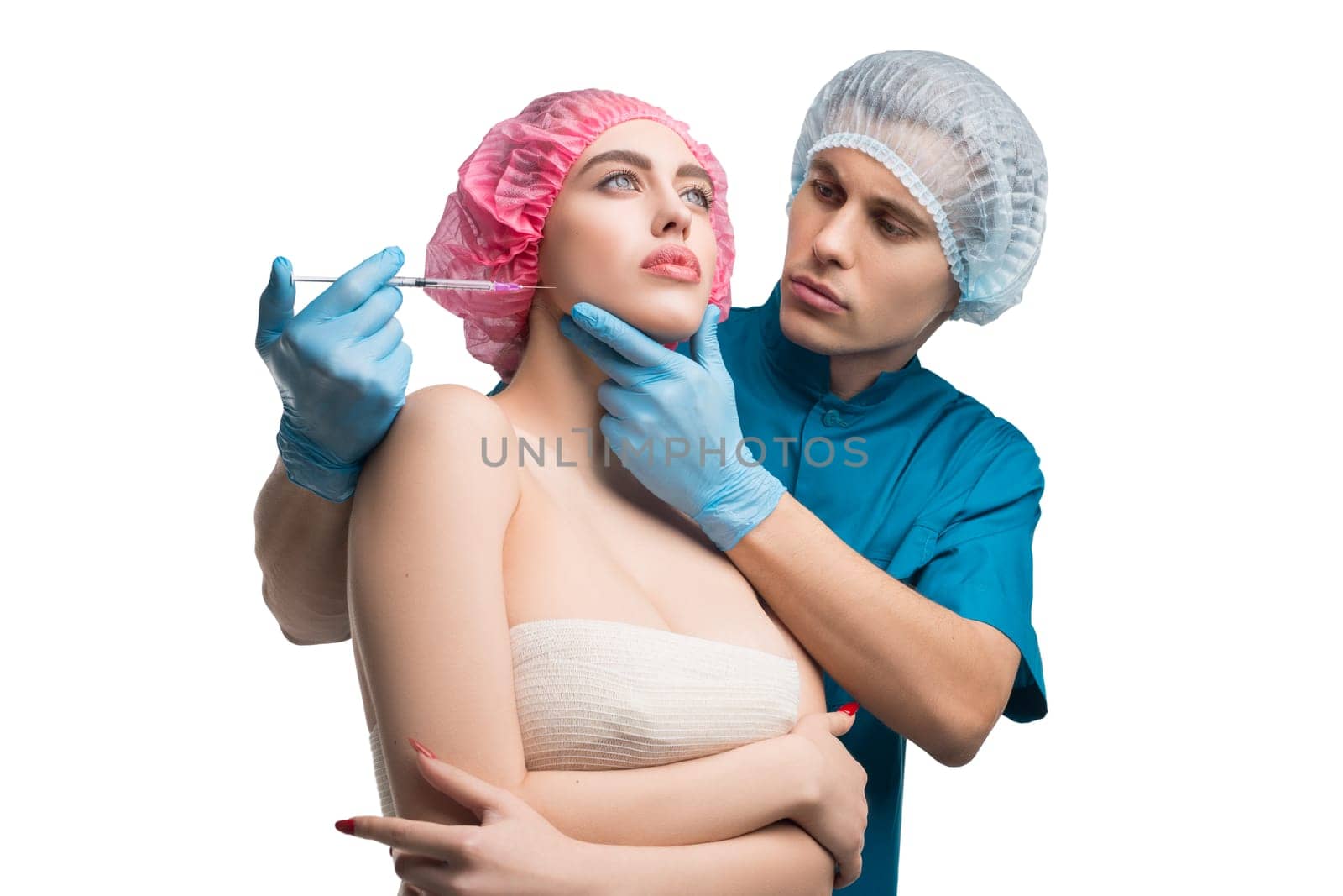Handsome plastic surgeon examining his female pretty patient face isolated portrait on white background