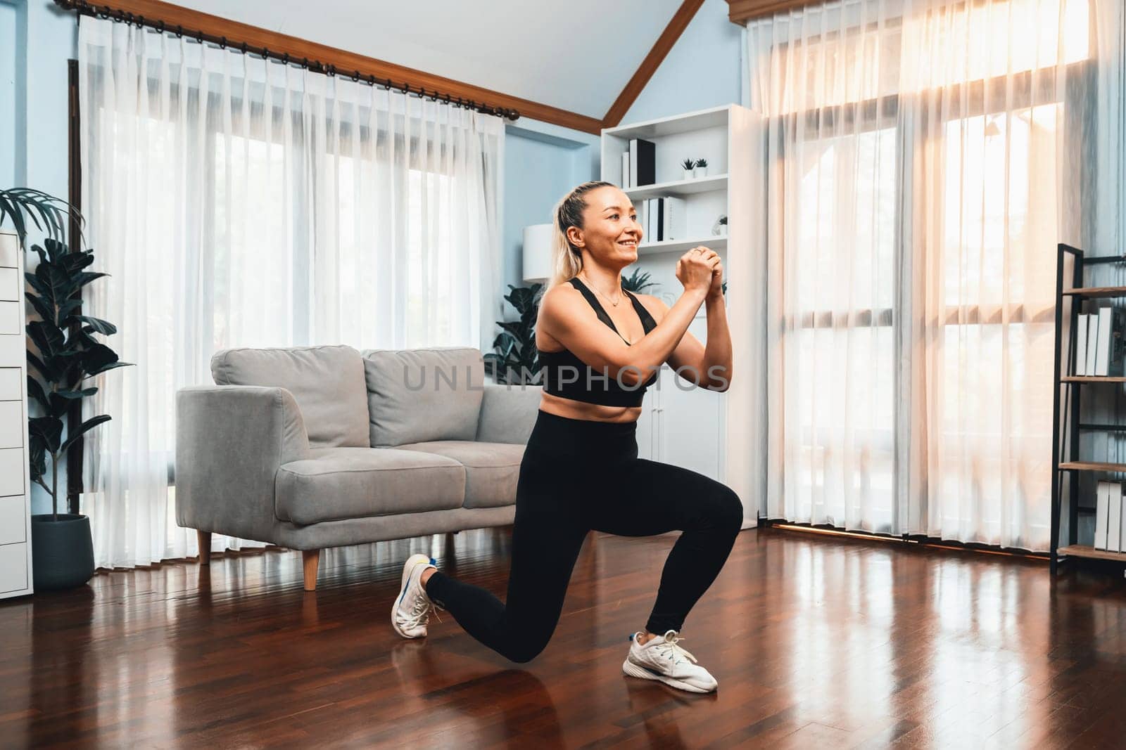 Active and fit senior woman warmup and stretching before home exercising routine at living room. Healthy fitness lifestyle concept after retirement for pensioner. Clout