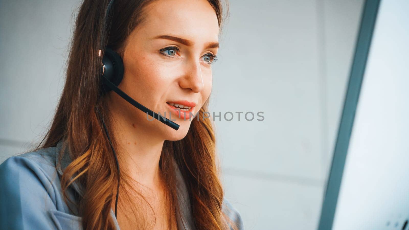 Business people wearing headset working in office to support remote customer or colleague. Call center, telemarketing, customer support agent provide service on telephone video conference call. Jivy