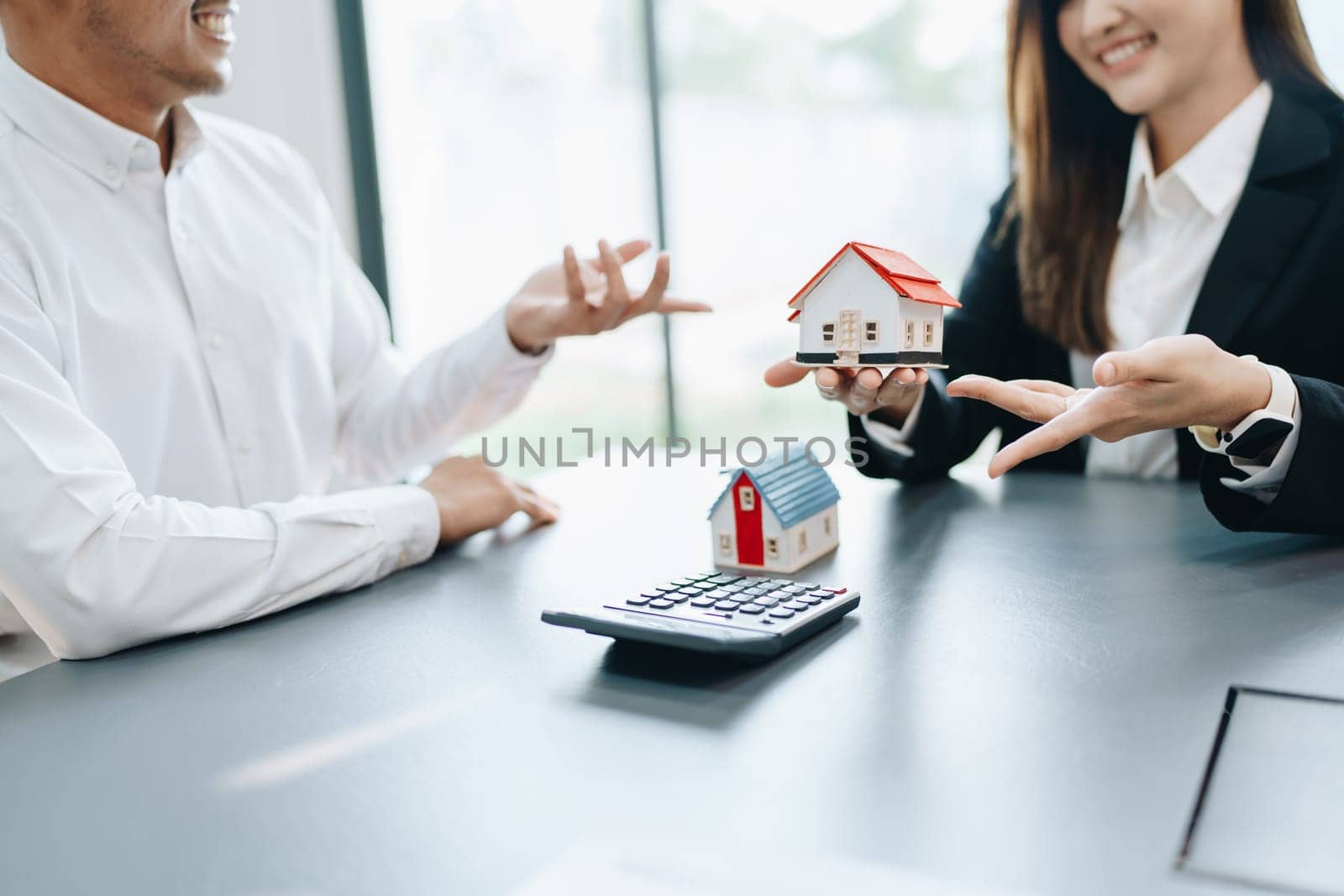 Guarantee, mortgage, agreement, contract, sign, real estate agent delivers the house to the customer after signing important contract documents.