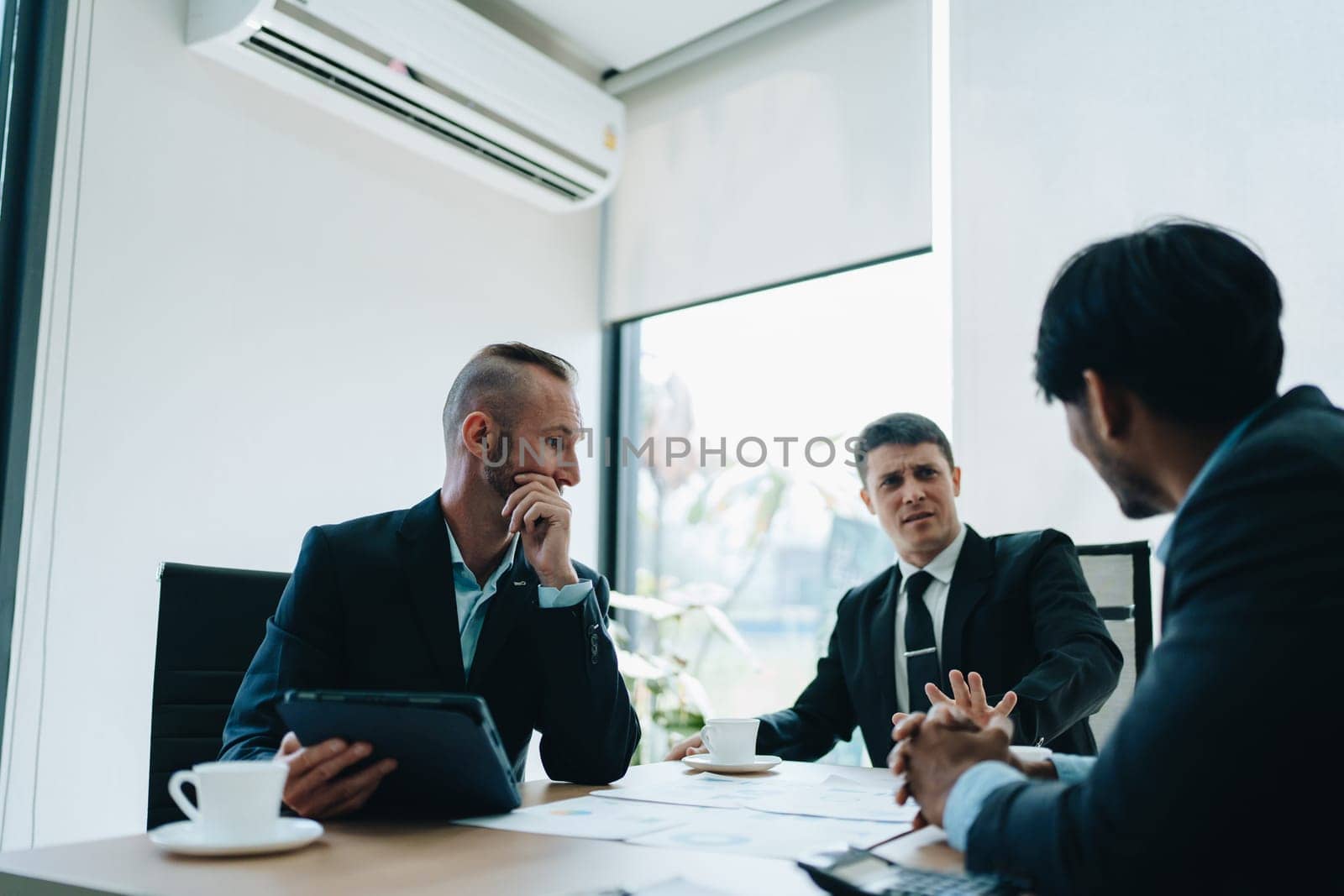 Asian business advisor meeting to analyze and discuss the situation on the financial report in the meeting room.Investment Consultant, Financial , teamwork ,brainstorming ,startup and accounting.