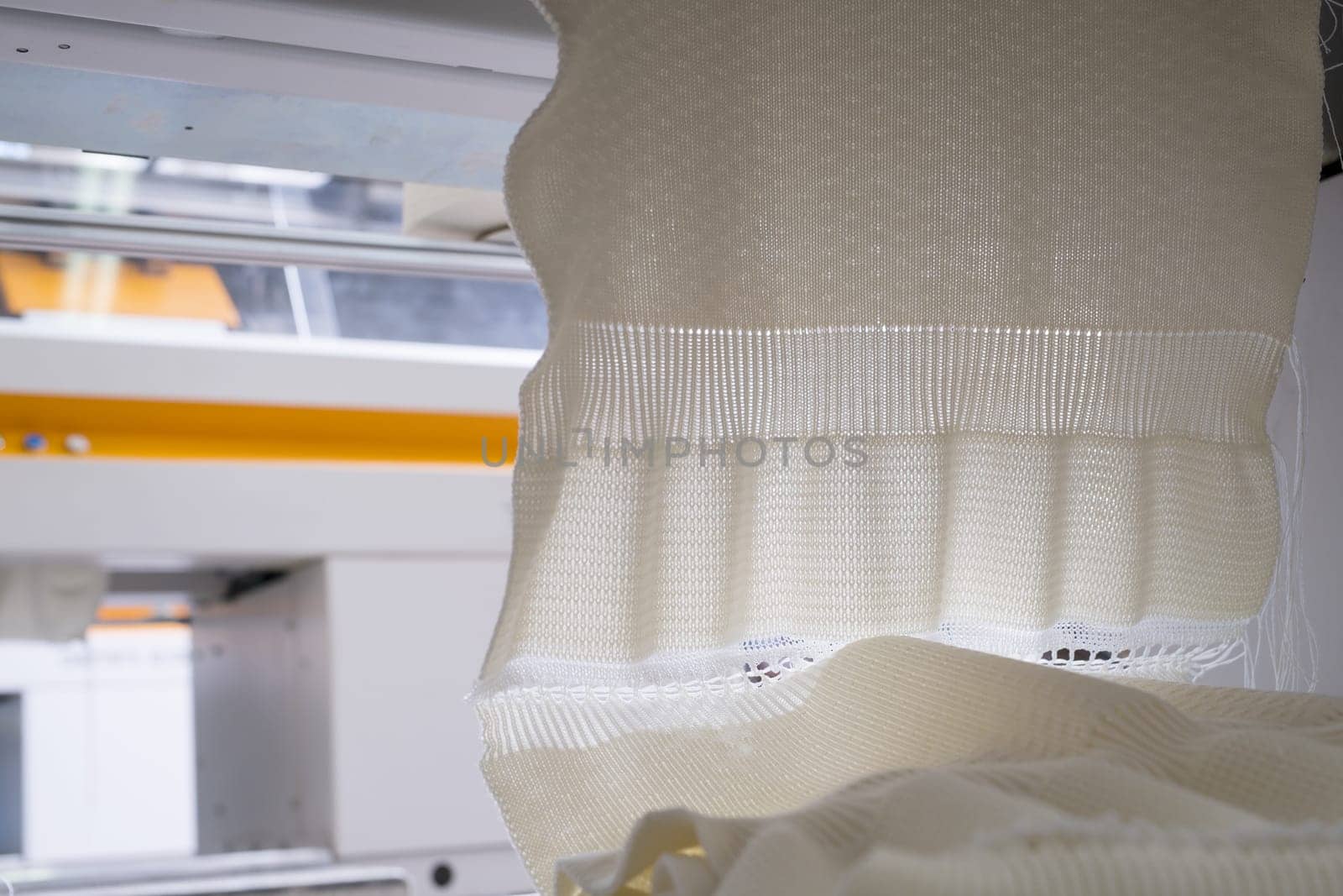 Produced white knitted fabric view at a knitting shop