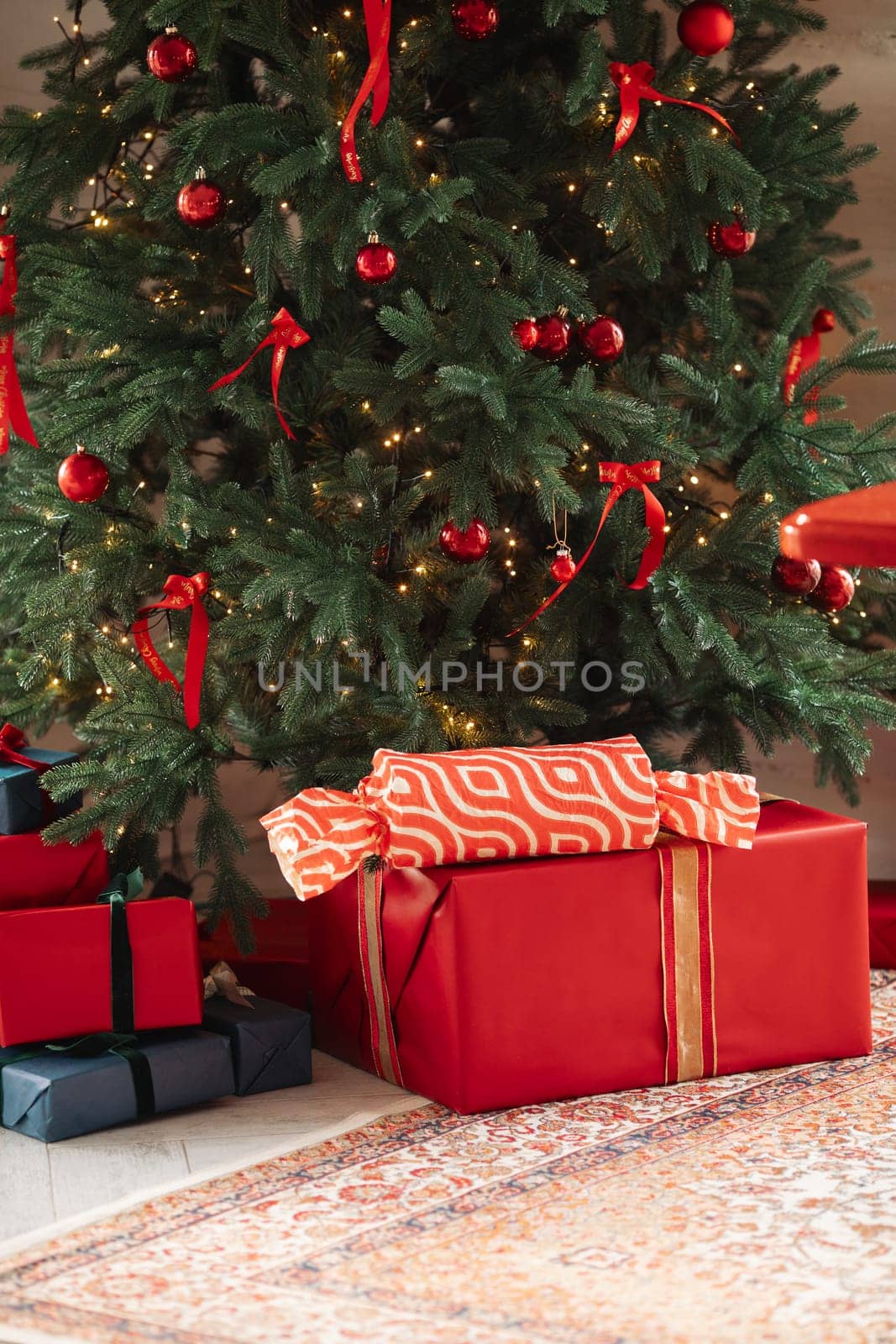 gifts under the tree, lots of gift boxes. Festive mood.