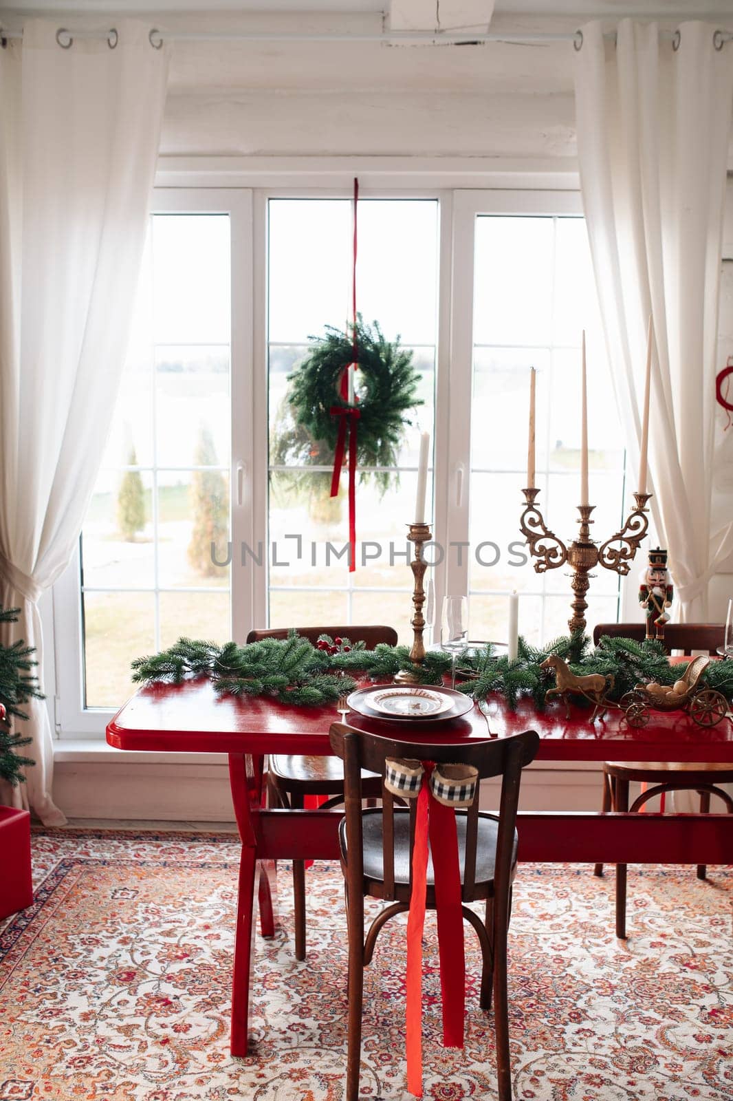 Beautiful Christmas interior. A table and a Christmas tree, a festive table. decoration.