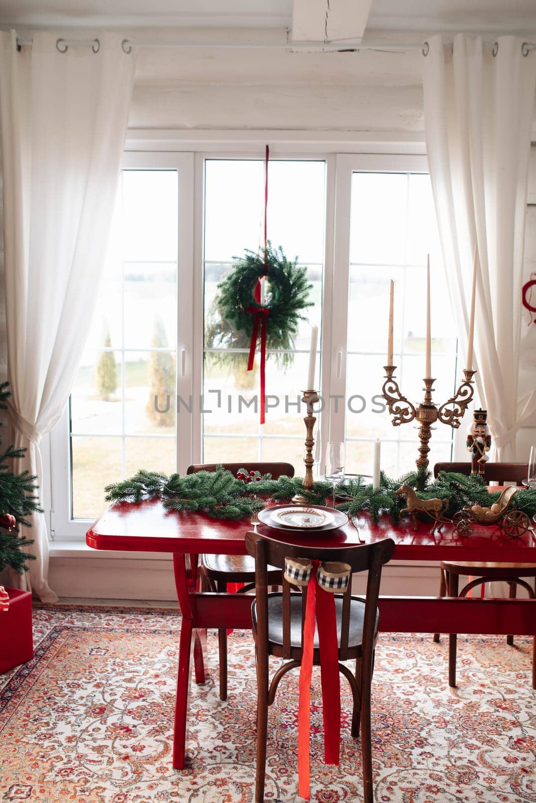 Beautiful Christmas interior. A table and a Christmas tree, a festive table. decoration.