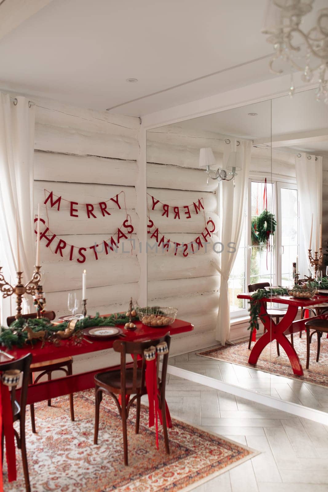 Beautiful Christmas interior. A table and a Christmas tree, a festive table. decoration.