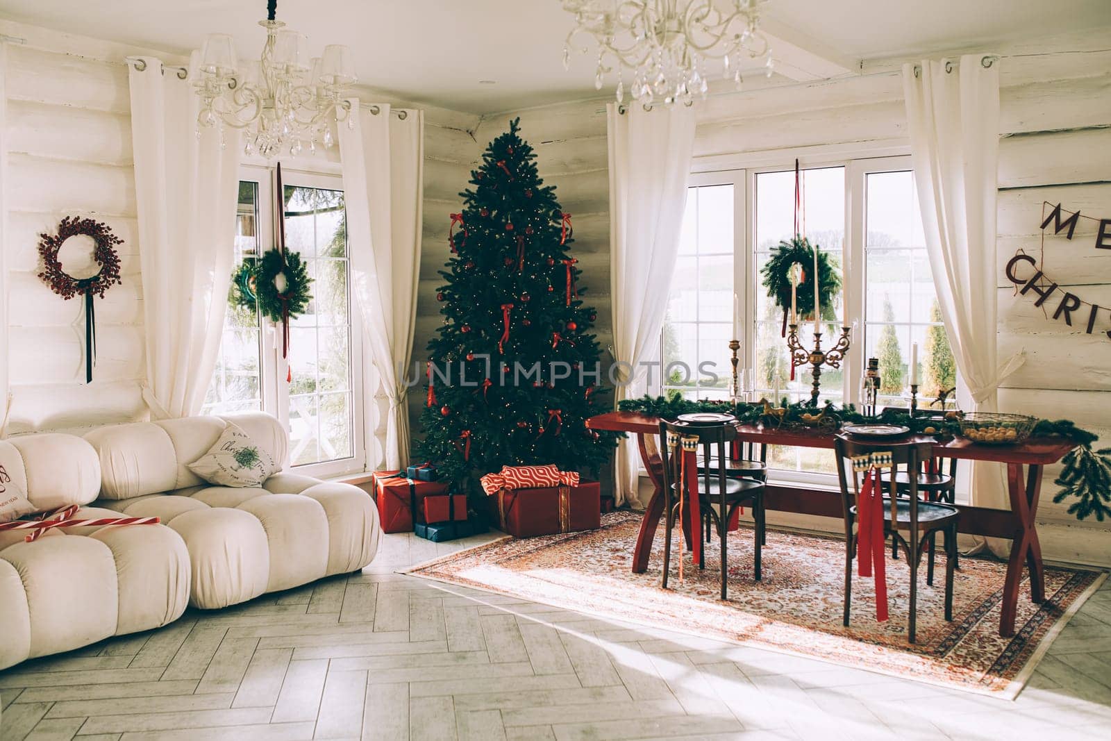 Stylish Christmas tree, New Year's interior, beautiful decor in the house.