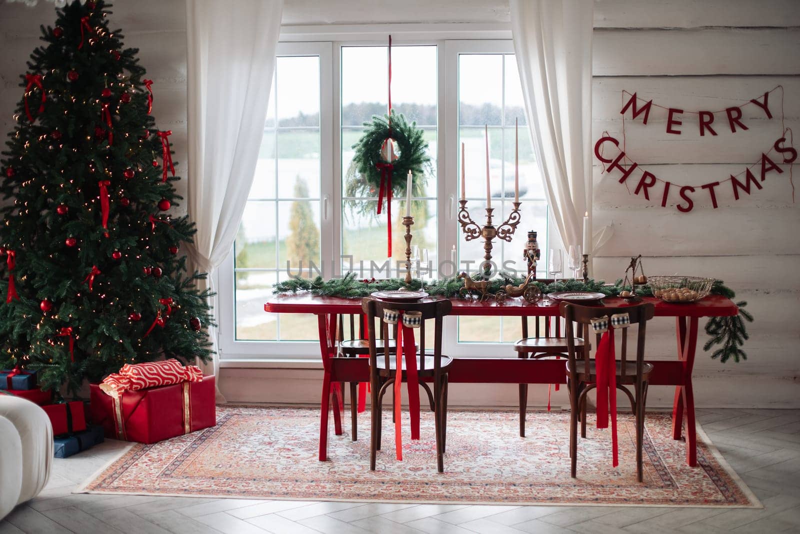Stylish Christmas tree, New Year's interior, beautiful decor in the house.