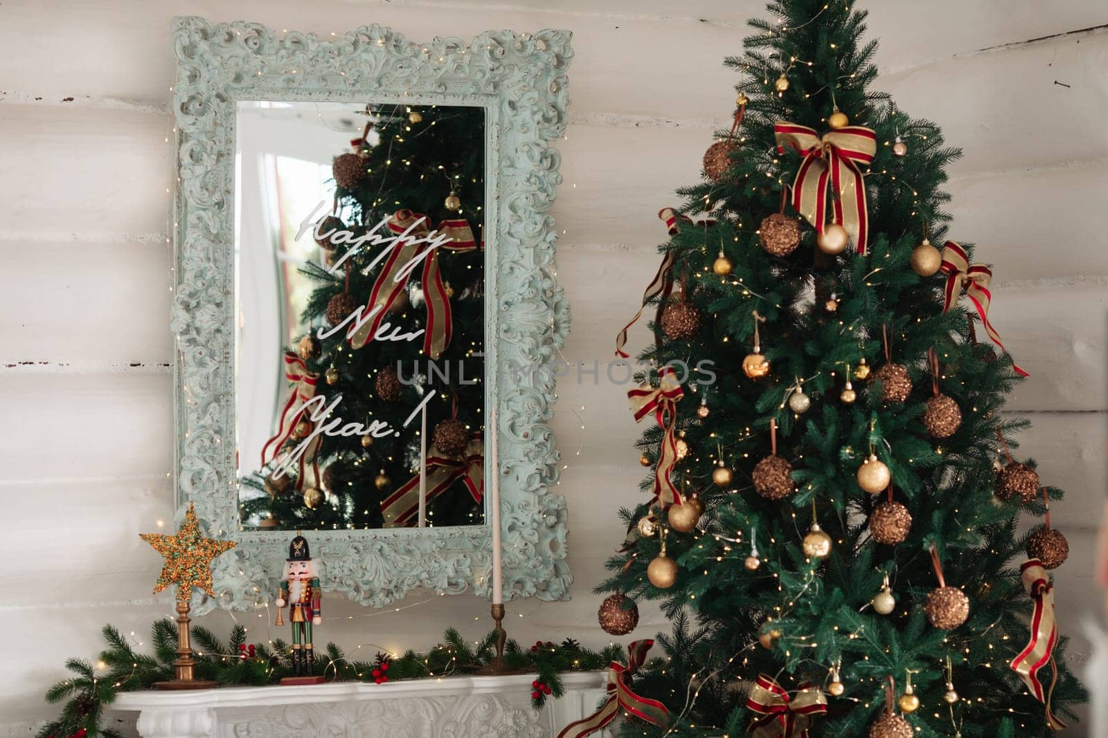 Stylish Christmas tree, New Year's interior, beautiful decor in the house.