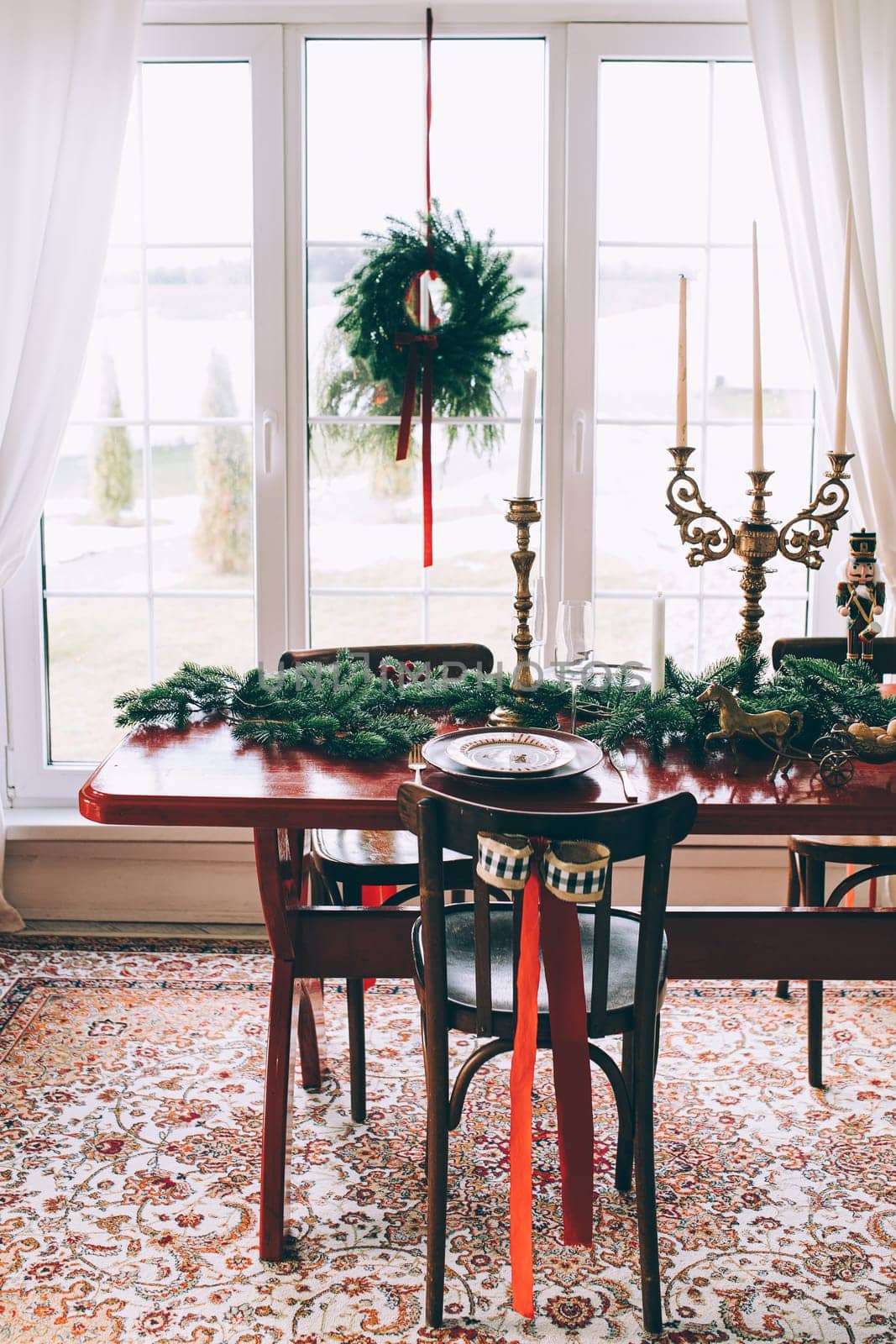 Beautiful Christmas interior. A table and a Christmas tree, a festive table. decoration.