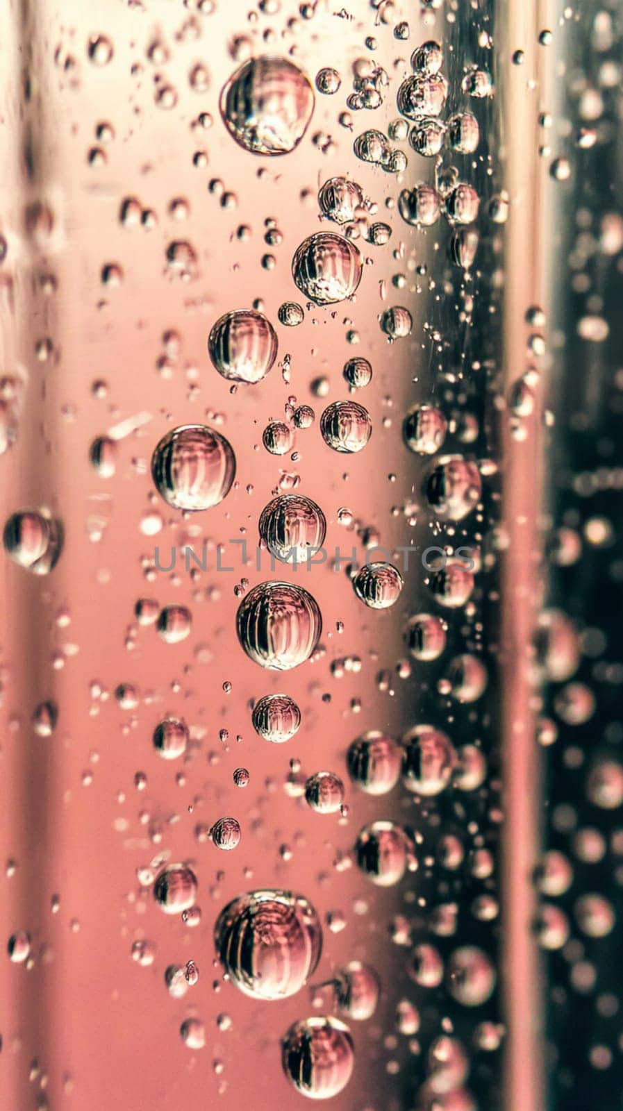 Abstract background showing transparent spheres floating in pink liquid with a 9,16 aspect ratio, perfect for mobile phone wallpaper
