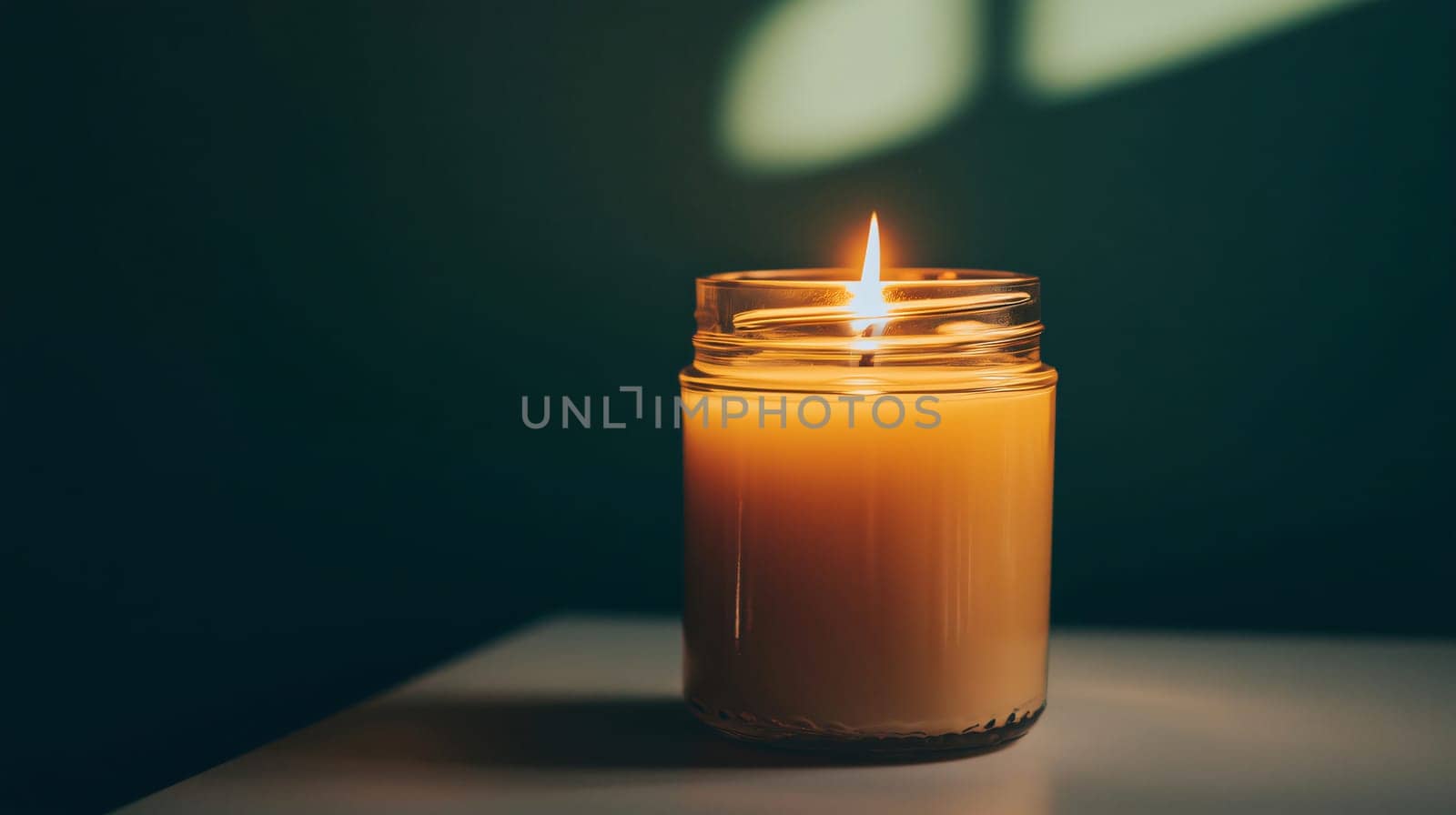 Close-up of a burning candle emanating a warm light, creating a cozy and inviting atmosphere
