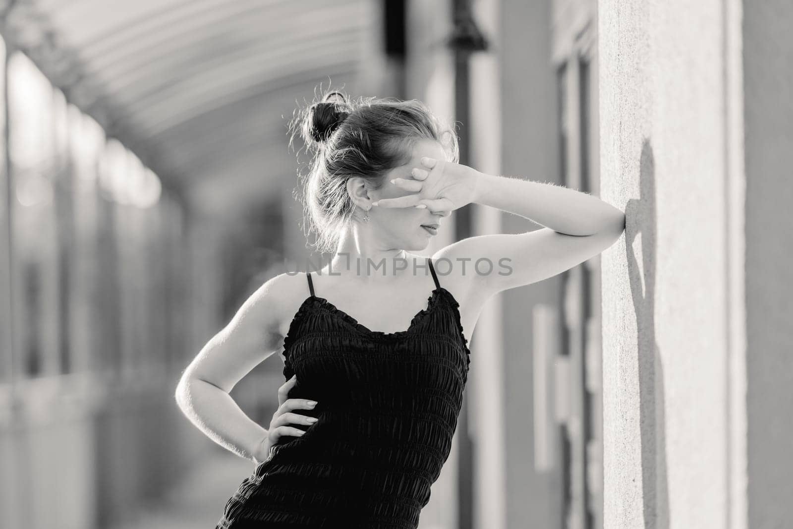 Portrait Captures Young Girl In Fashion Style Dress On Street In Black And White