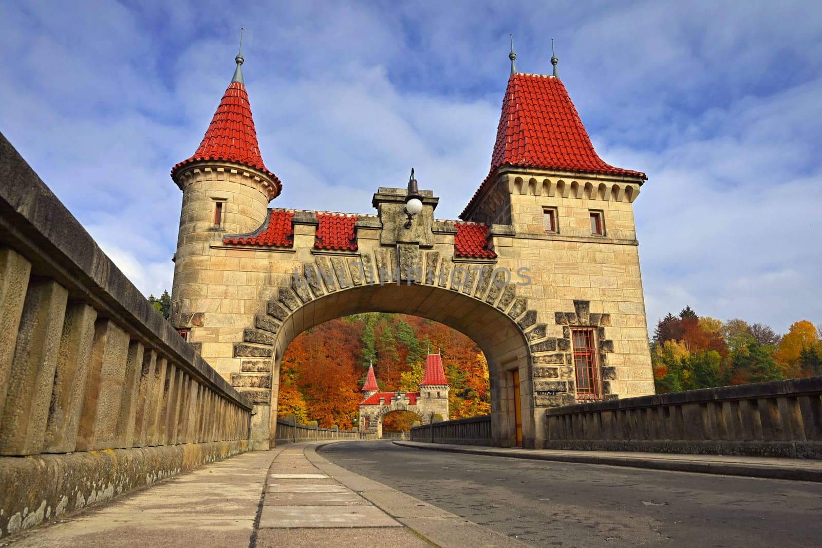 Beautiful old dam Les Kralovstvi - Czech Republic. Autumn background with colorful trees. Nature with landscape. Seasonal concept for fall.