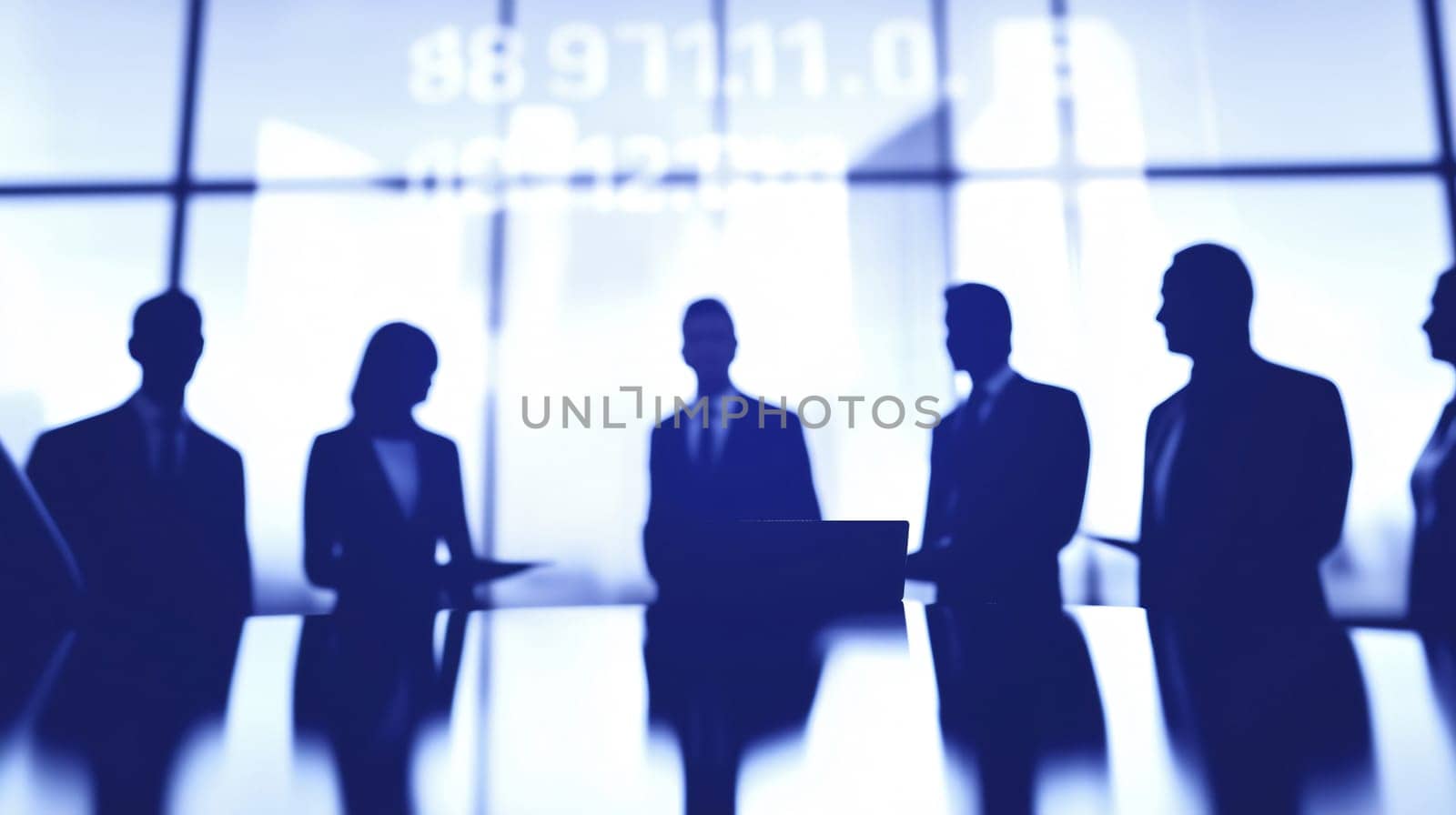 Silhouettes of business people standing around a table, analyzing data for their company