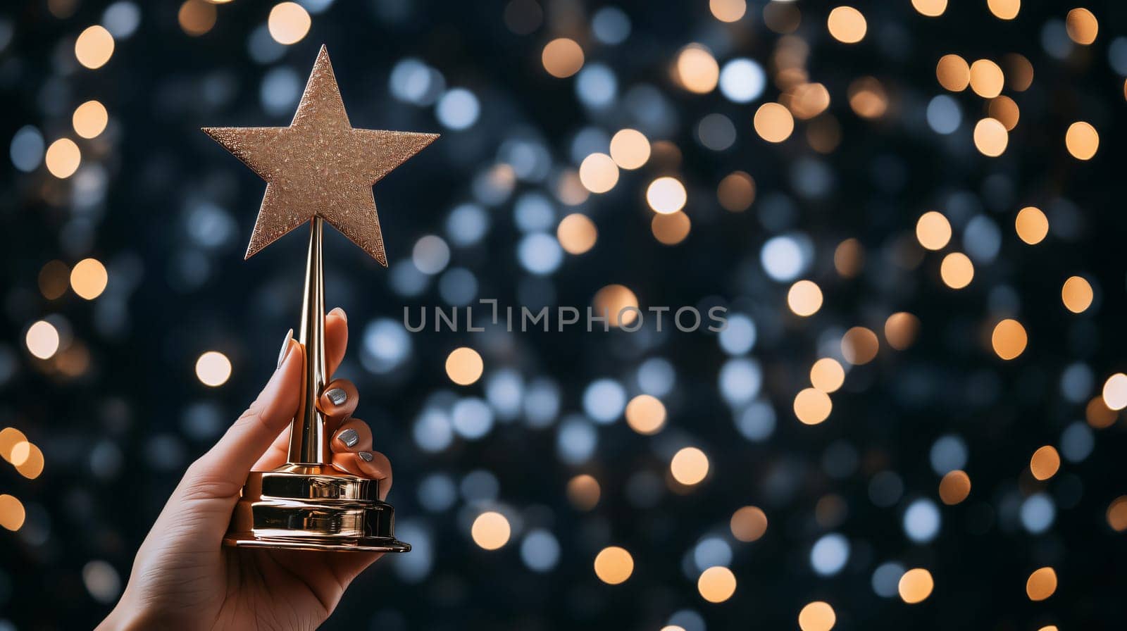 Woman is holding golden star award trophy against blurred lights background