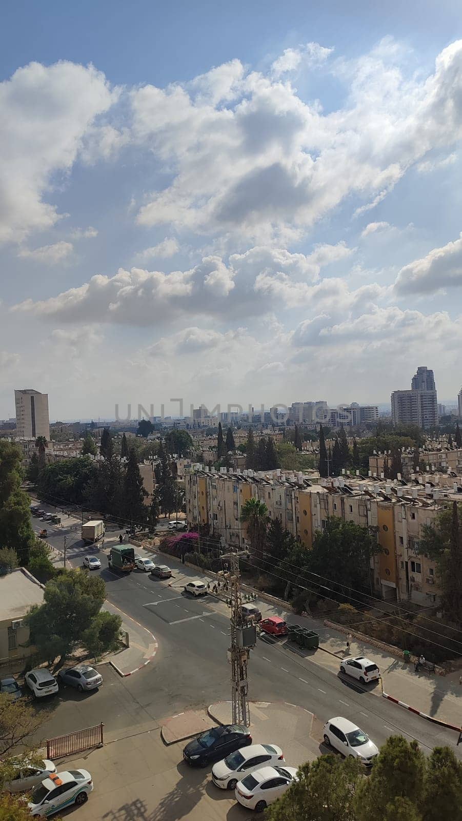 November 3 2024 Beer-Sheva, Israel city day sky clouds, cars and building street landscape . High quality photo