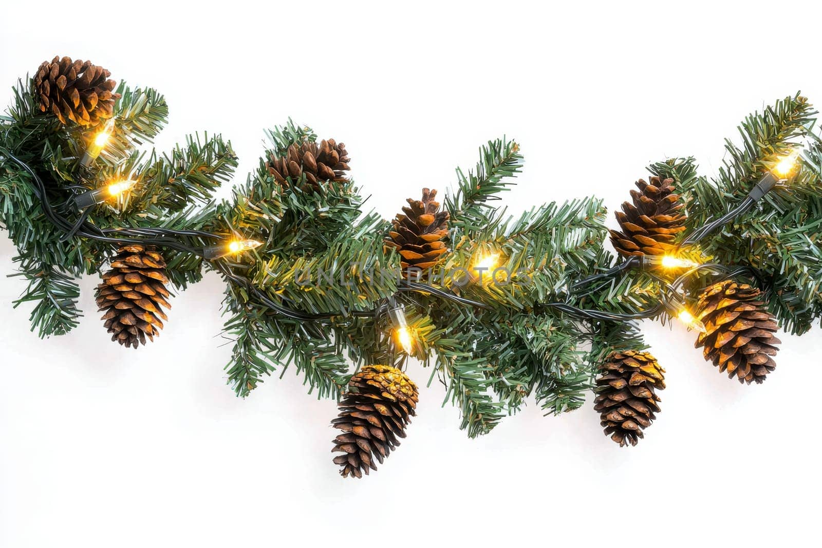 Christmas tree branch garland with cones and lights on white isolated background..