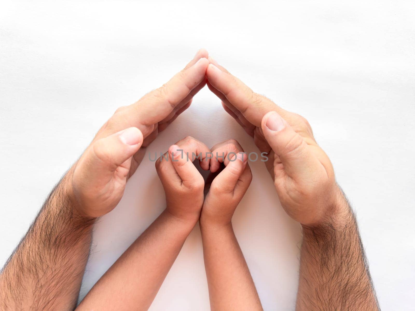 Family protection and care. Hands creating a safe space for a child.